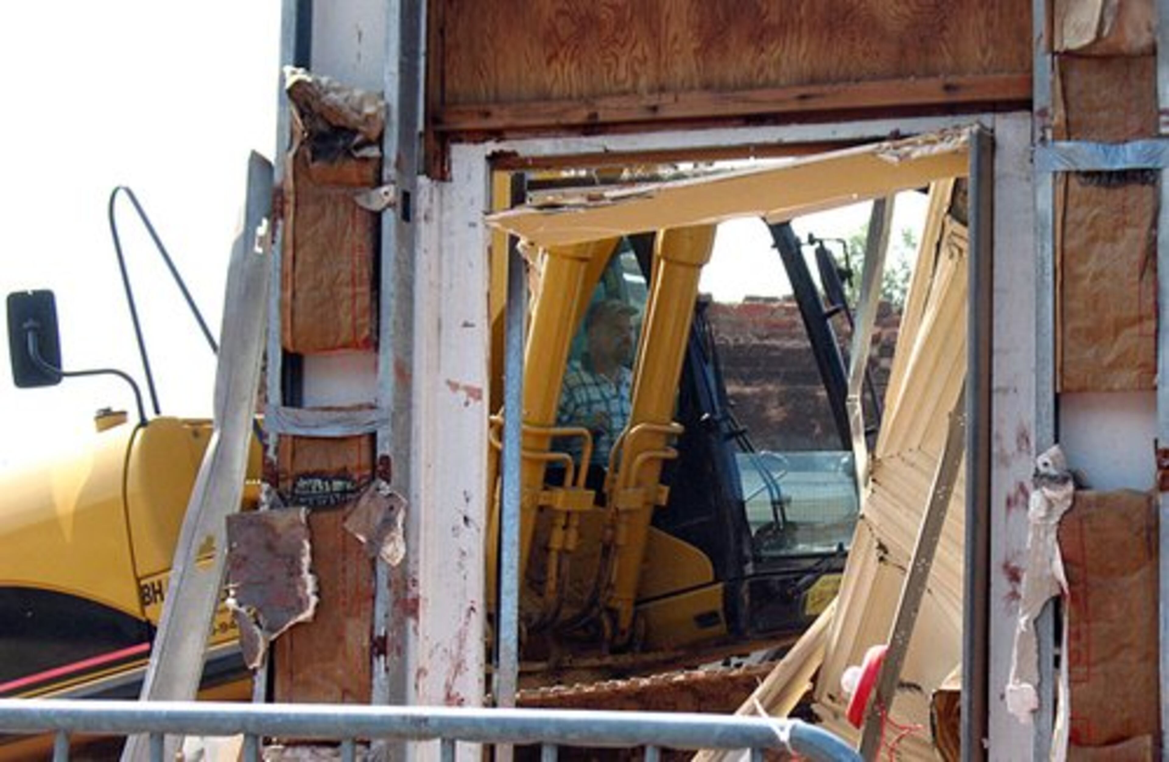 Duluth levels the oldest portion of the city's prized Red Clay Theatre on Wednesday morning. The razing comes just a month after crews demolished another section of the building as part of a plan to widen Ga. 120 and increase the historic district's visibility from Buford Highway. What remains is the 1990s-era stage and seating area.