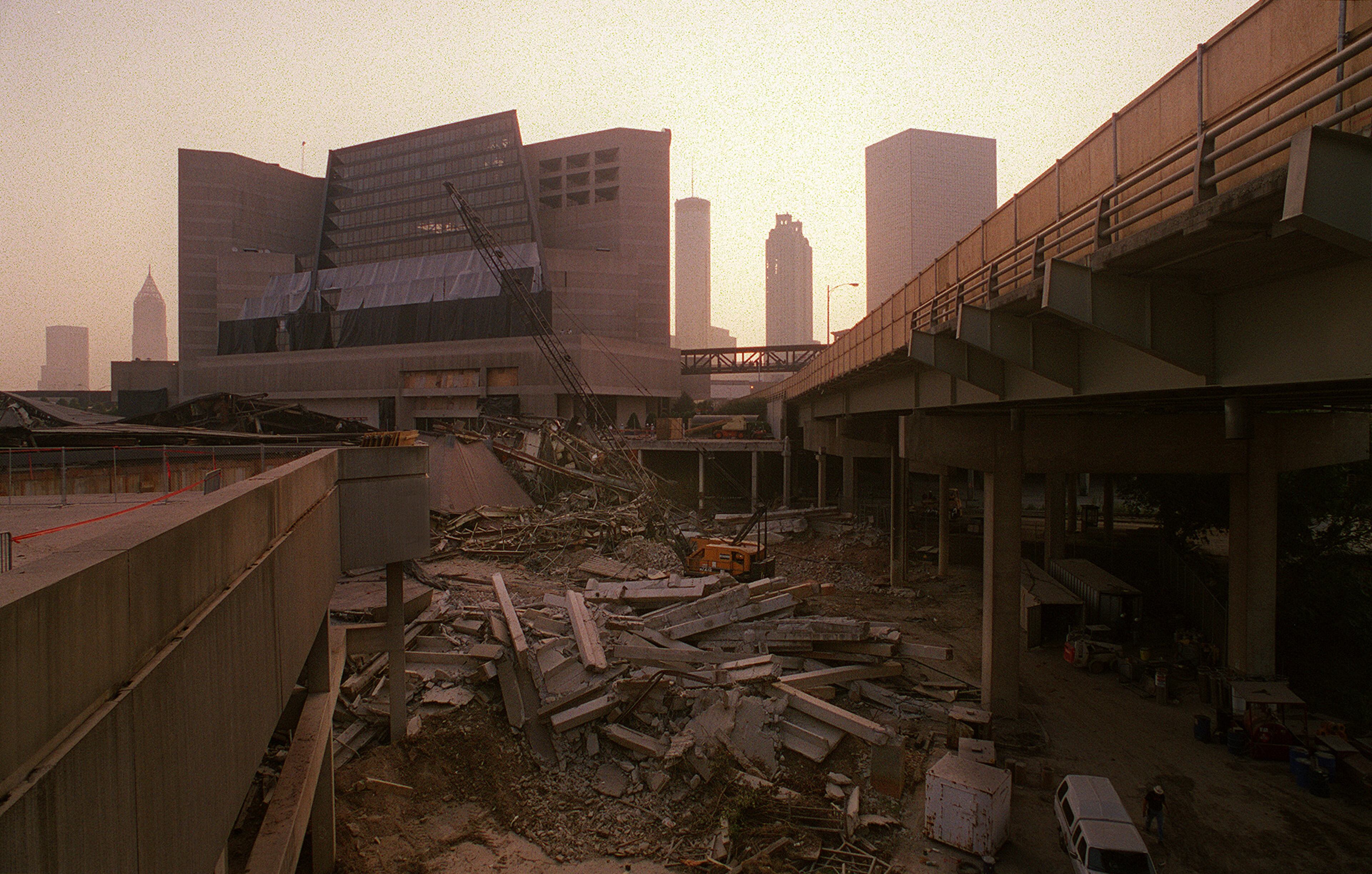 970726 - Atlanta, Georgia - The Omni lies in a pile of rubble after the implosion Saturday morning 7/26/97. The CNN building is in the background. (AJC Staff Photo/Jean Shifrin)