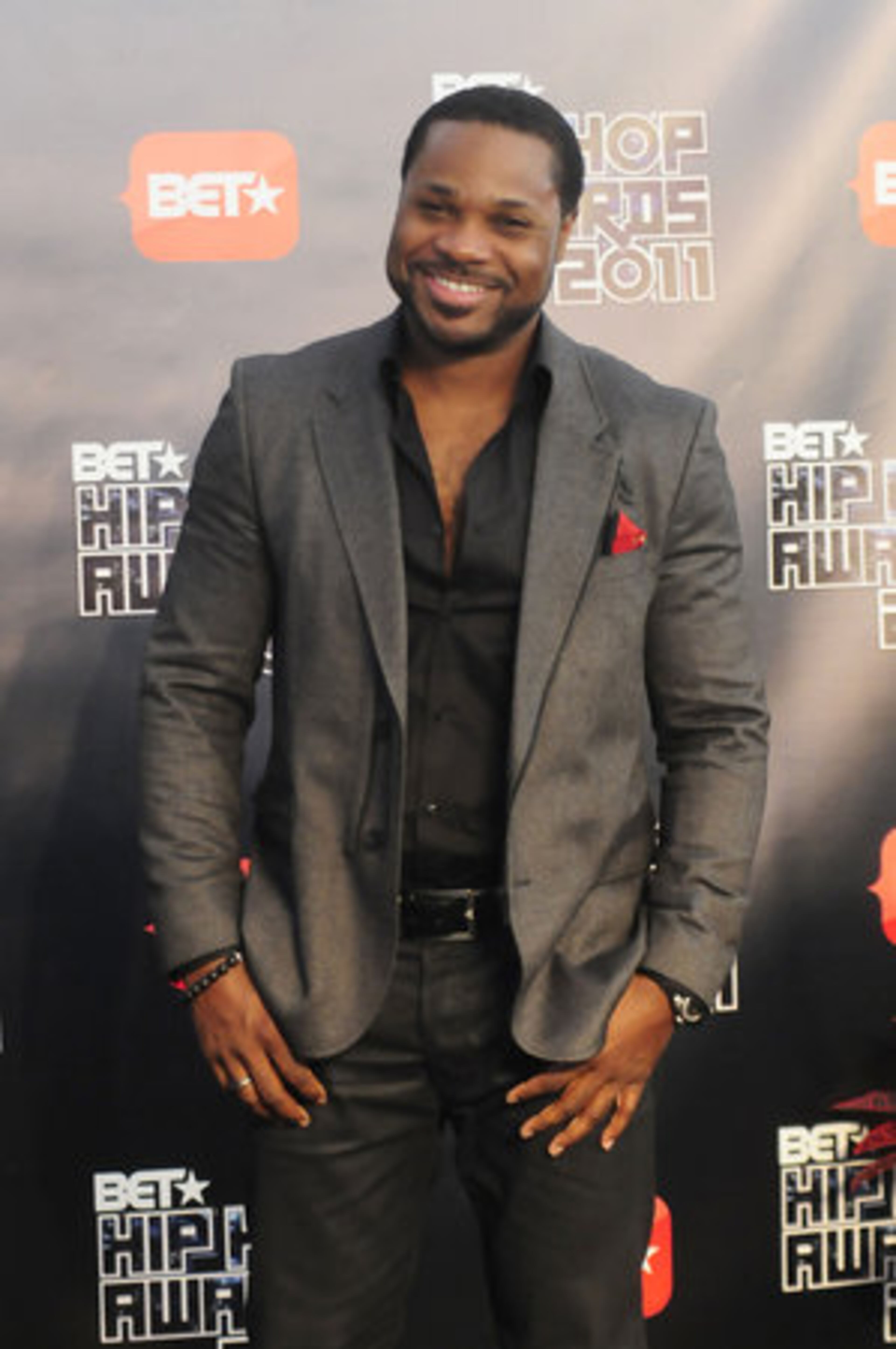 'Cosby' kid Malcolm Jamal Warner smiles as his photo is taken.