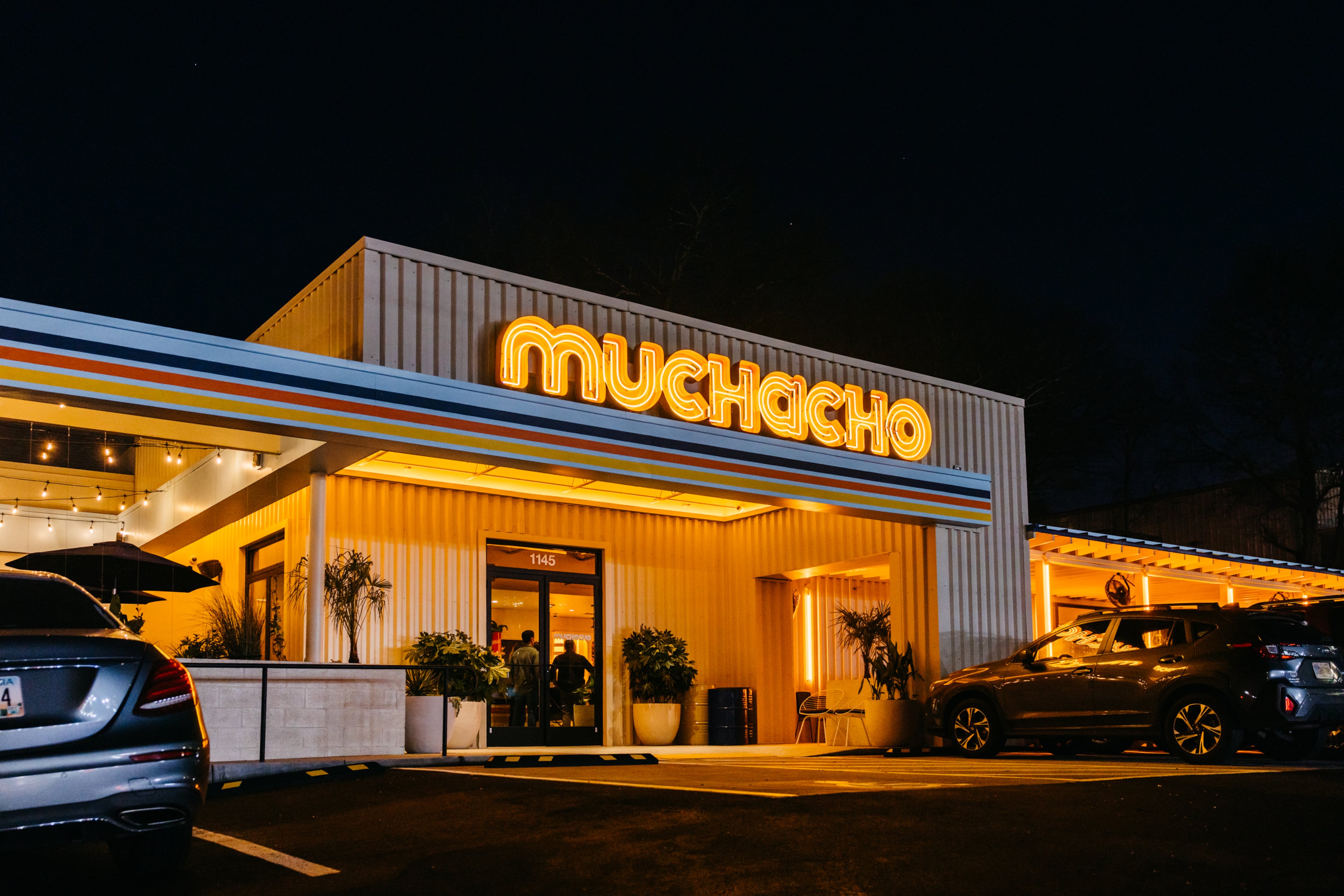 The semi-industrial exterior of Muchacho fits the theme of the west Midtown landscape, while the vibrant orange color scheme helps it stand out. (Courtesy of Luke Beard/Muchacho)