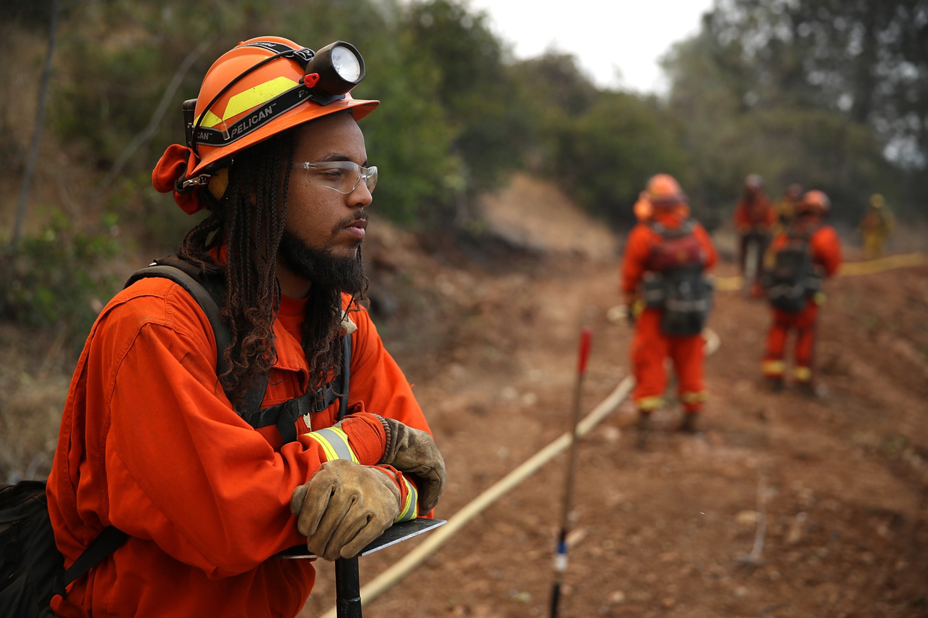 MARIPOSA, CA - JULY 19: California Department of Corrections inmate fire crews monitor the Detwiler Fire on July 19, 2017 in Mariposa, California. More than 1,400 firefighters are battling the Detwiler Fire that has burned more than 45,000 acres, forced hundreds to evacuate and destroyed at least eight structures. The fire is seven percent contained. (Photo by Justin Sullivan/Getty Images)