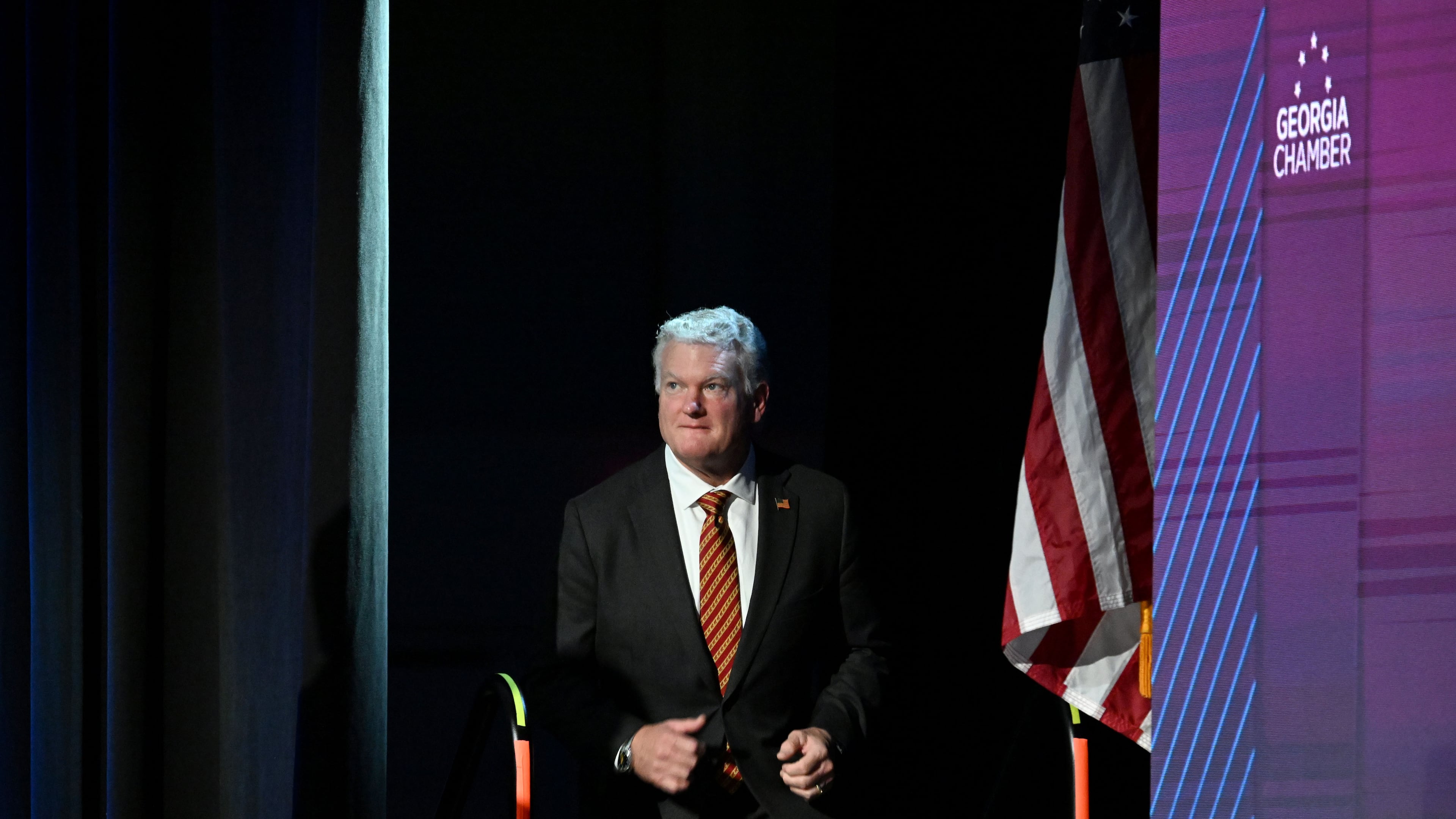 U.S. Rep. Mike Collins takes the stage before delivering a speech during the Georgia Chamber Congressional Luncheon at The Classic Center in Athens on Wednesday, Aug. 5, 2026. (Hyosub Shin/AJC)