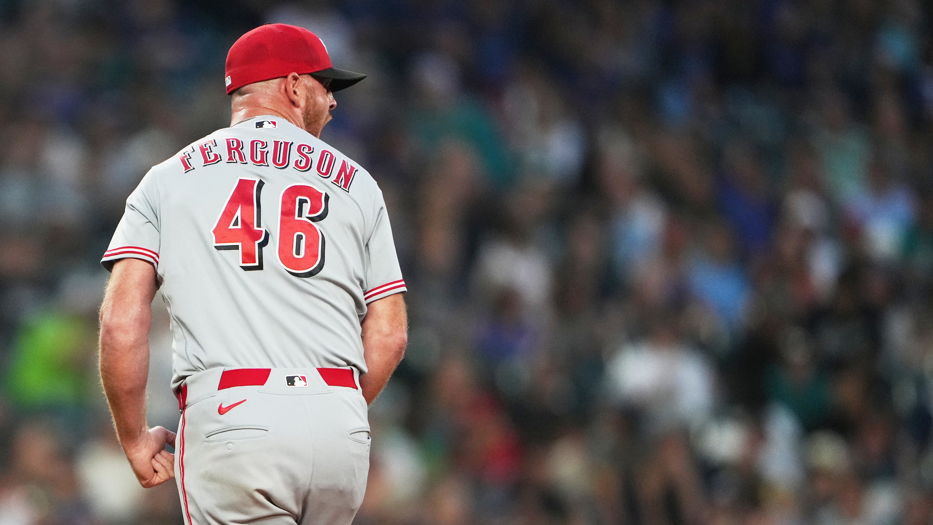 Cincinnati Reds relief pitcher Caleb Ferguson reacts in the seventh inning of a baseball game against the Seattle Mariners, Monday, July 20, 2026, in Seattle. (AP Photo/Lindsey Wasson)
