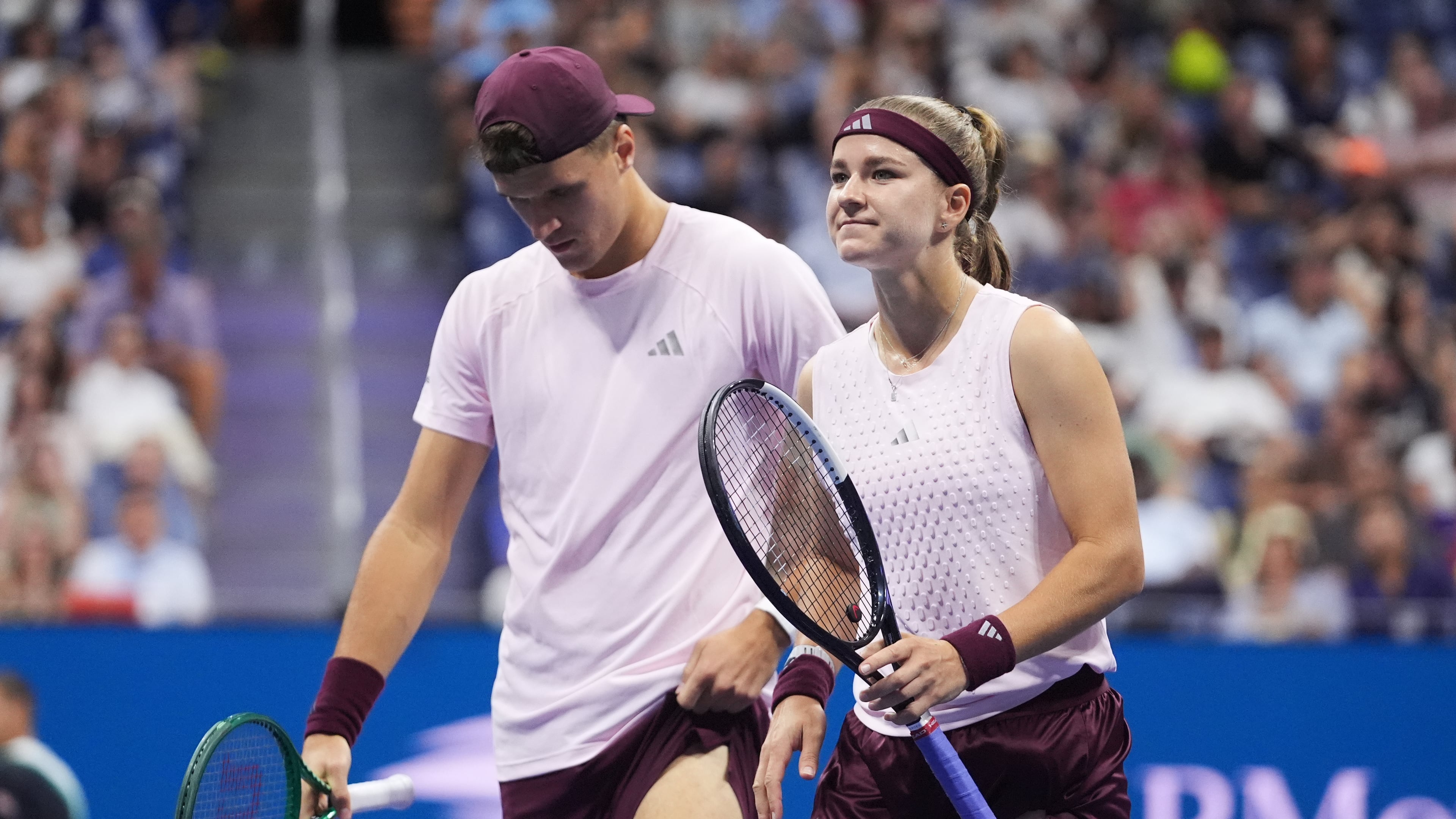 Jakub Mensik, left, of the Czech Republic, and Karolina Muchova, of the Czech Republic, react during the mixed doubles final match against Belinda Bencic, of Switzerland, and Flavio Cobolli, of Italy, at the U.S. Open tennis championships Wednesday, Aug. 26, 2026, in New York. (AP Photo/Frank Franklin II)