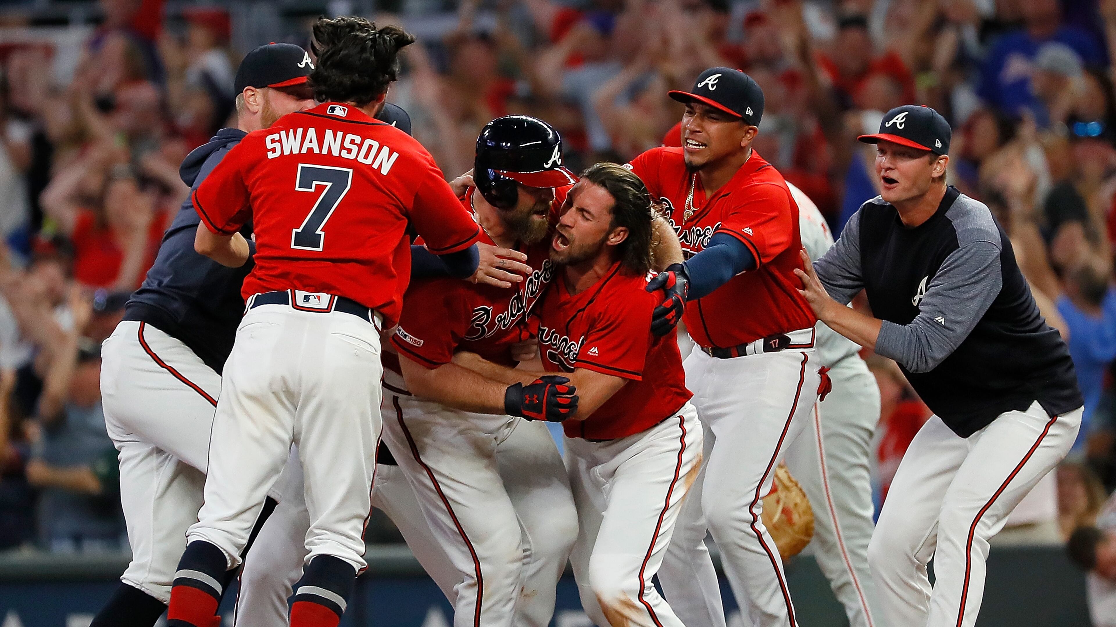 Brian McCann is swarmed after hitting a walk-off single to score two runs to give the Braves a 9-8 win over the Philadelphia Phillies at SunTrust Park on June 14, 2019 in Atlanta.