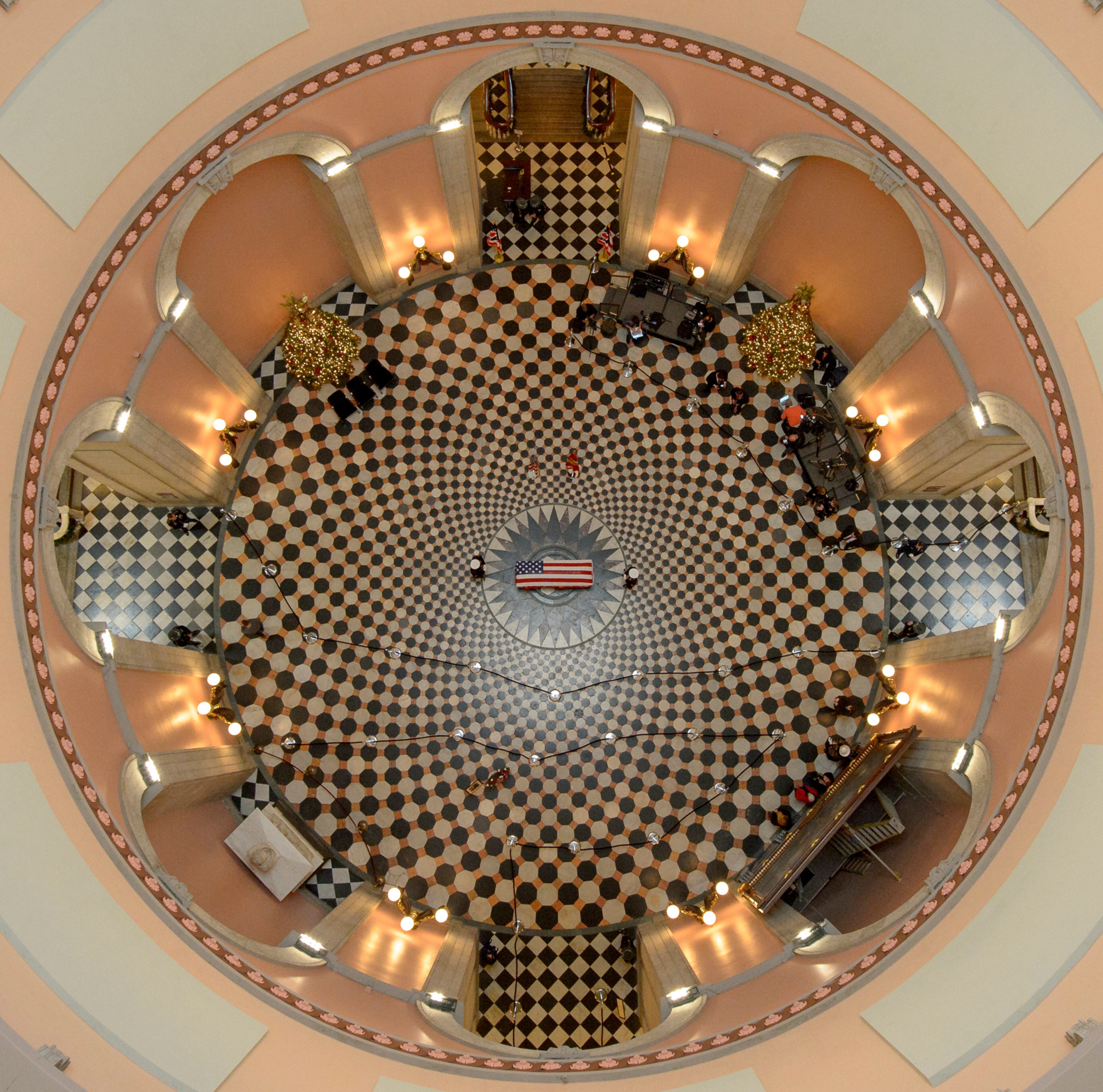 This photo provided by NASA shows the casket of John Glenn while he lies in repose, Friday, Dec. 16, 2016, in Columbus, Ohio. Glenn, 95, the first American to orbit Earth, died last week. (Bill Ingalls/NASA via AP)
