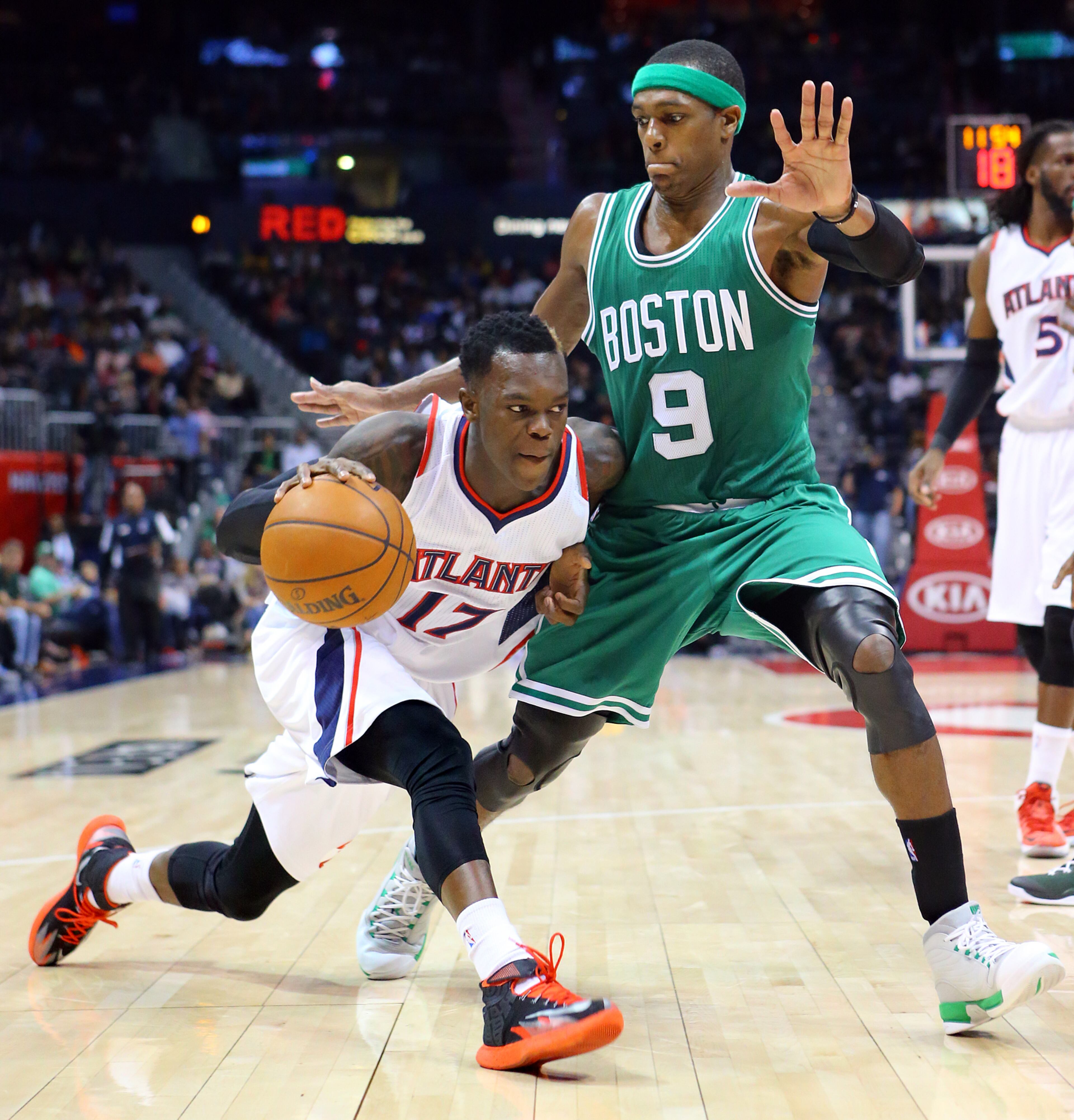 Hawks guard Dennis Schroder drives against Celtics Rajon Rondo leading the Hawks to a come from behind 109-105 victory in the second half of an NBA basketball game on Tuesday, Dec. 2, 2014, in Atlanta. CURTIS COMPTON / CCOMPTON@AJC.COM