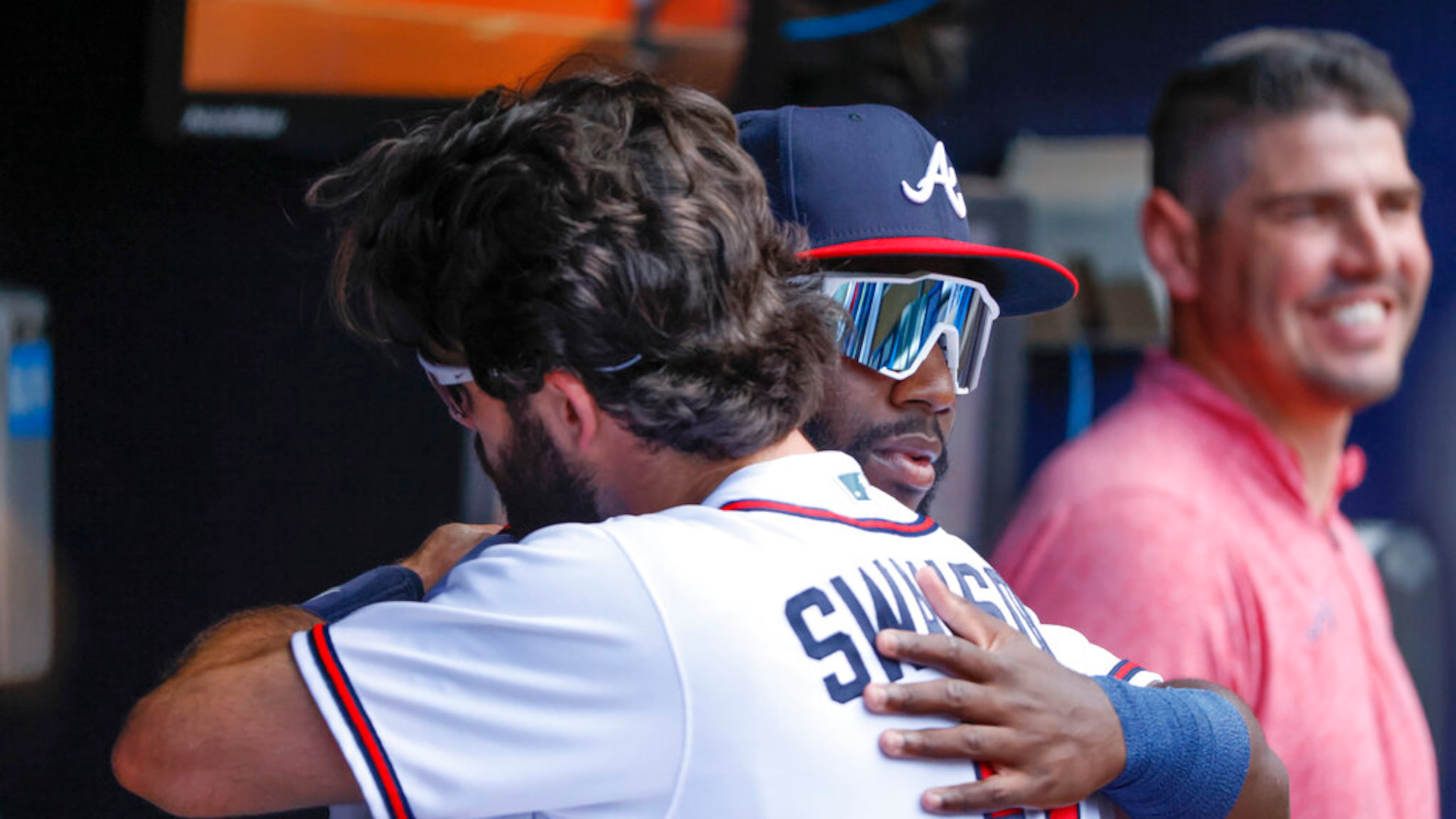 Braves center fielder Michael Harris, front right, making his MLB debut, gets a welcome hug from Dansby Swanson before a baseball game against the Miami Marlins, Saturday, May 28, 2022, in Atlanta. (AP Photo/Bob Andres)