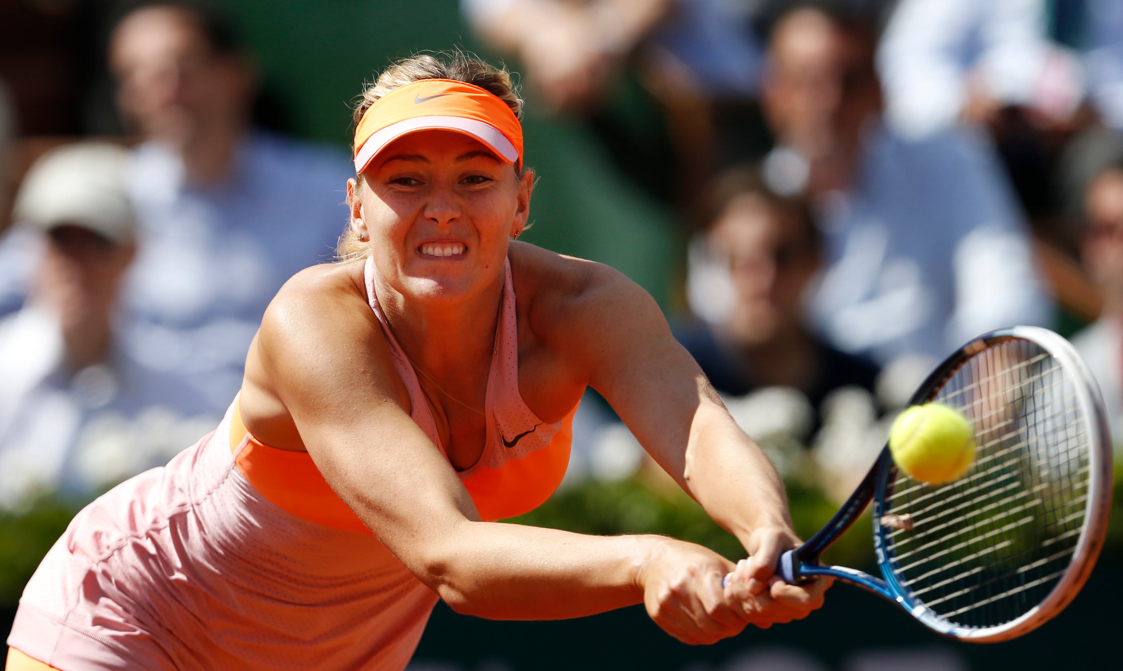 Russia's Maria Sharapova returns the ball during the semifinal match of the French Open tennis tournament against Canada's Eugenie Bouchard at the Roland Garros stadium, in Paris, France, Thursday, June 5, 2014. (AP Photo/Darko Vojinovic)