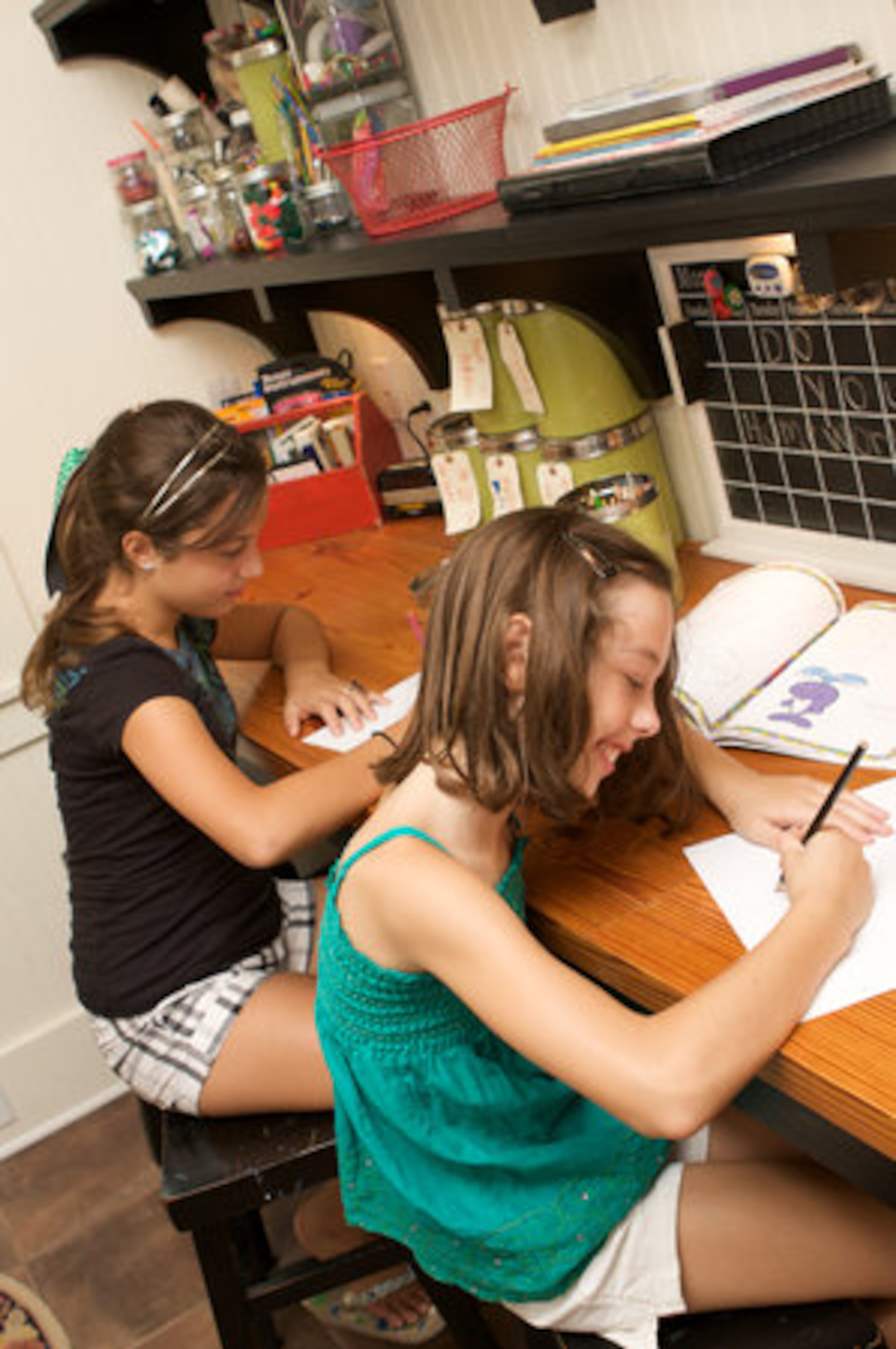 The laundry room doubles as Madi and Kate Strickland's craft room. "We have all kinds of 'kid art.' We are 'kid art' fanatics and that is what we decorate the house with. Most of it has been created in this room," Todd Strickland says.