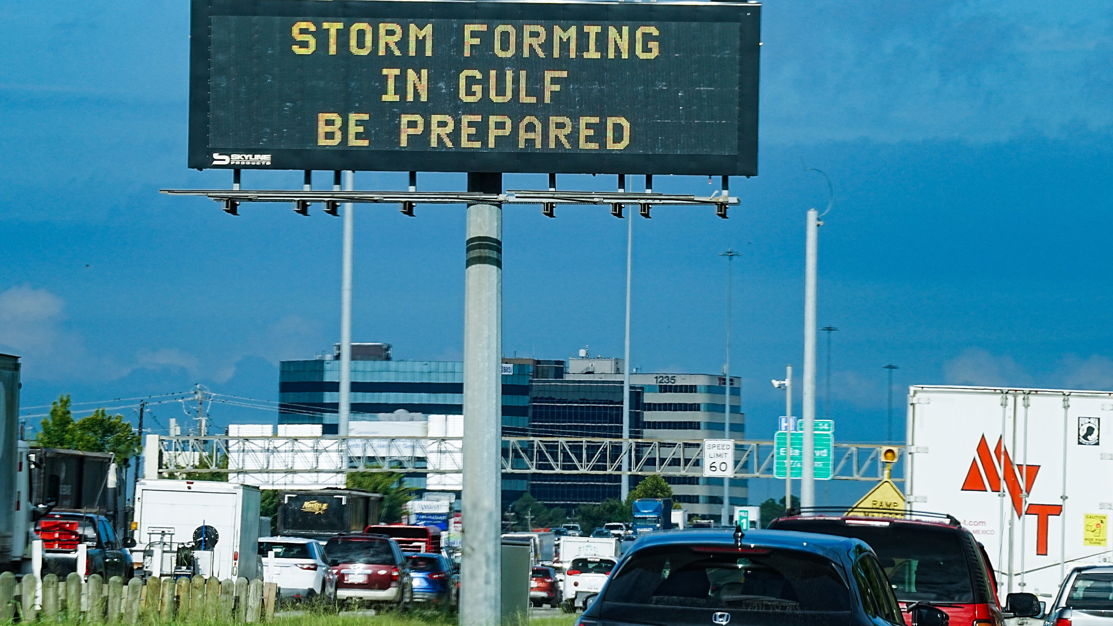 Motorists drive by Texas Department of Transportation signs on I-610 as Tropical Storm Edouard approaches in Houston, Tuesday, Sept. 1, 2026. (Elizabeth Conley/Houston Chronicle via AP)