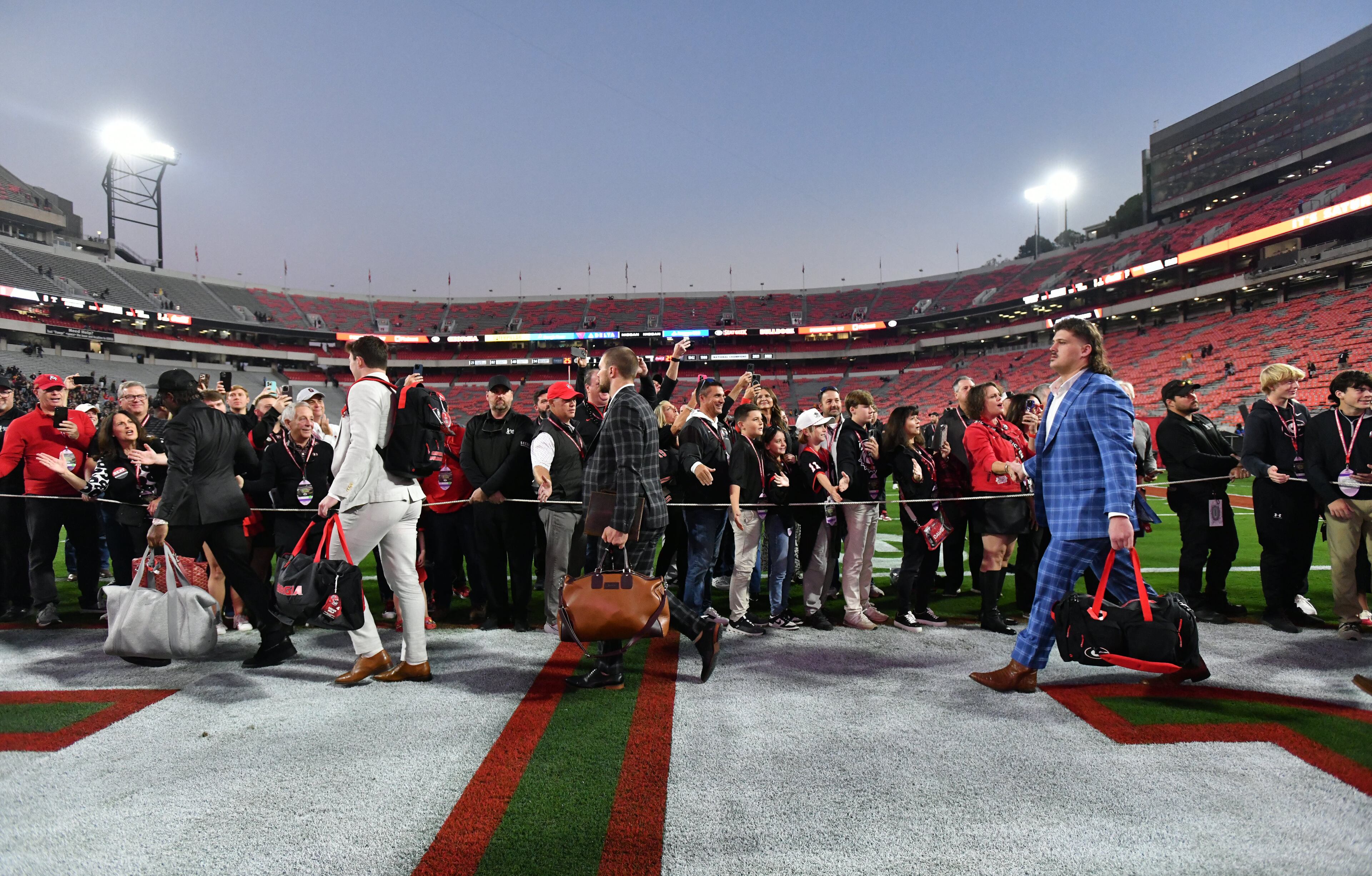 Georgia players and staff arrive during Dawgs Walk before an NCAA football game between Georgia and Tennessee at Sanford Stadium, Saturday, November 16, 2024, in Athens. (Hyosub Shin / AJC)