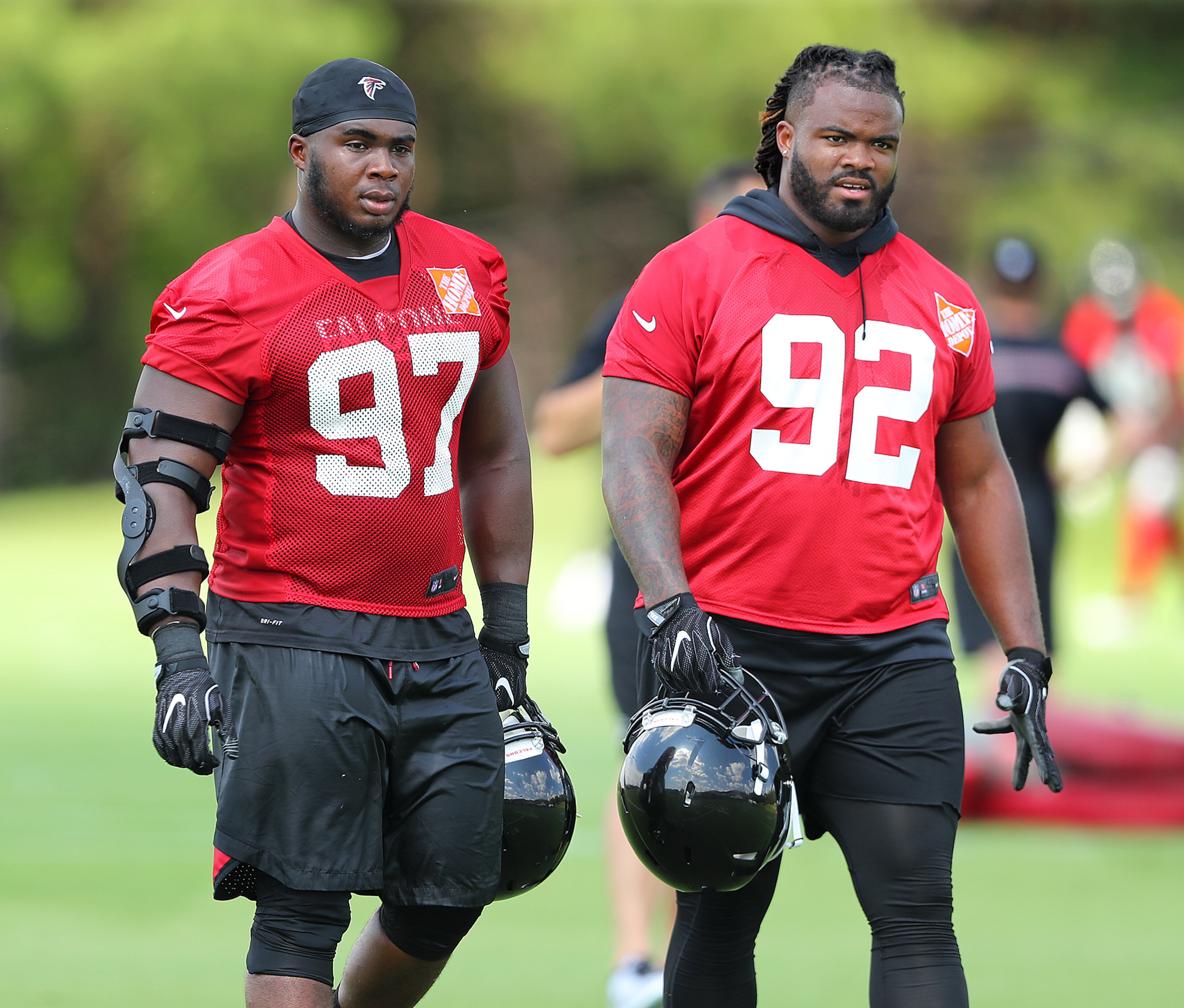 June 13, 2017, Flowery Branch: Atlanta Falcons defensive tackles Dontari Poe (right) and Grady Jarrett walk off the field at the conclusion of the first day of mini-camp on Tuesday, June 13, 2017, in Flowery Branch. Curtis Compton/ccompton@ajc.com