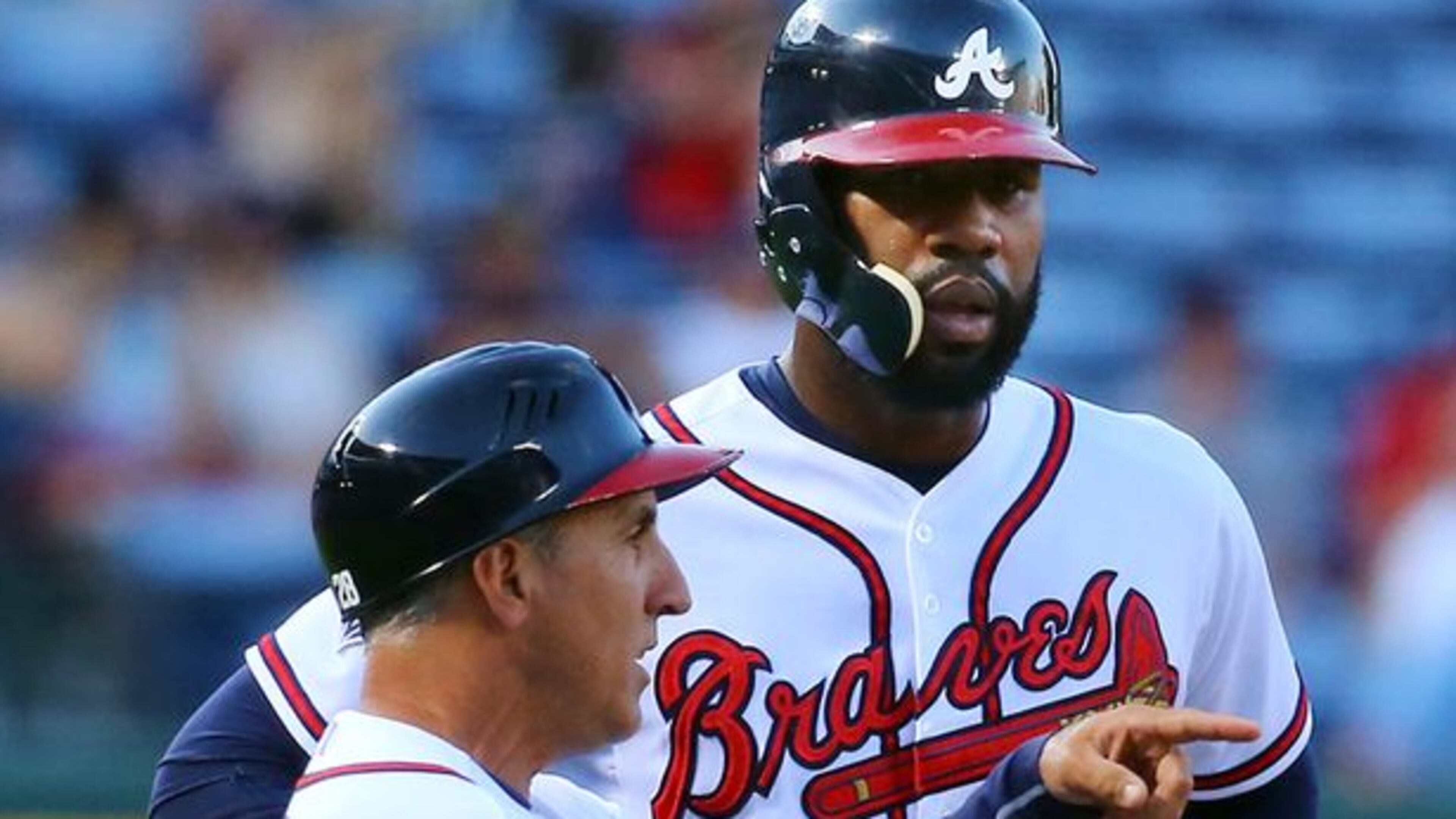 Jason Heyward is 6-for-8 against Friday's Cubs starter Jason Hammel. Heyward is also really large, as this photo of him next to third-base coach Doug Dascenzo illustrates. (Curtis Compton/AJC)