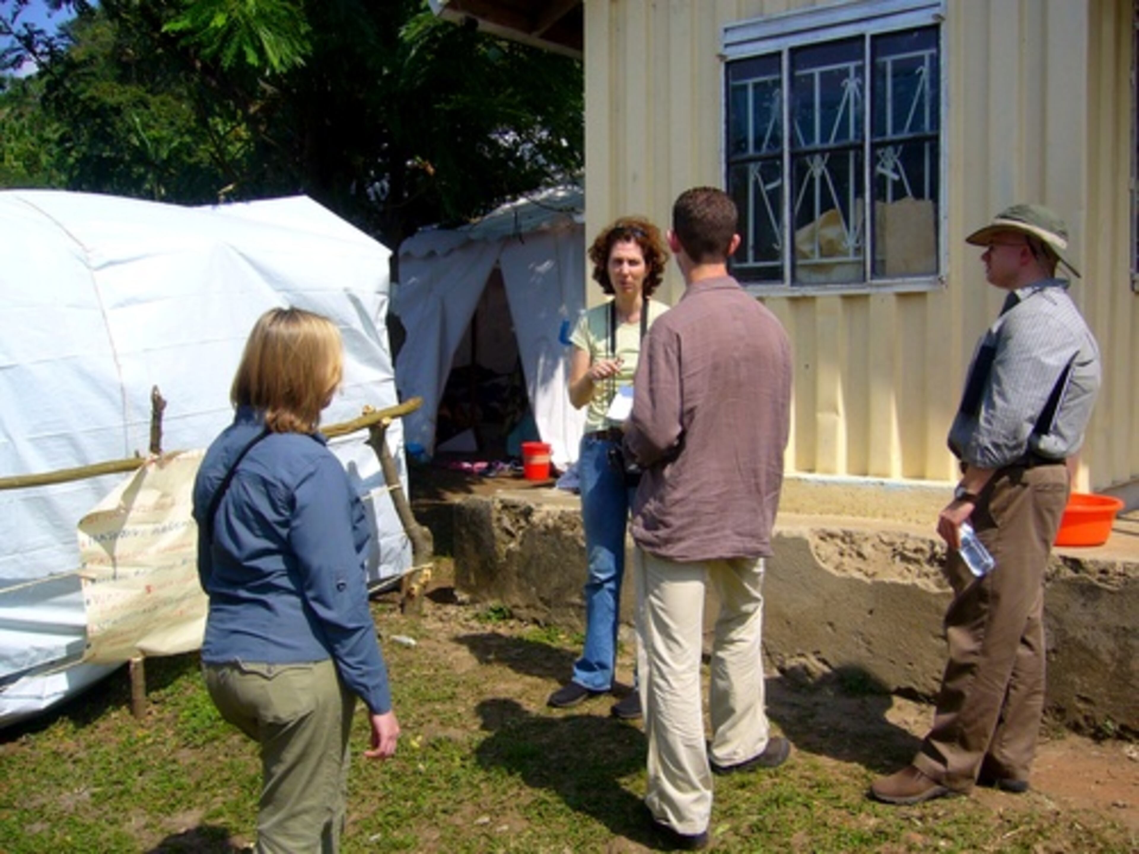 CDC disease detectives from Atlanta are helping the Ugandan health ministry and medical relief organizations track and monitor the family and friends of those sickened with Ebola. At the health compound in the outbreak zone of Bundibugyo, Dr. Eileen Farnon, a CDC epidemiologist, talks with CDC colleagues Ann Schmitz, Adam McNeil and Dr. Phil Gould.