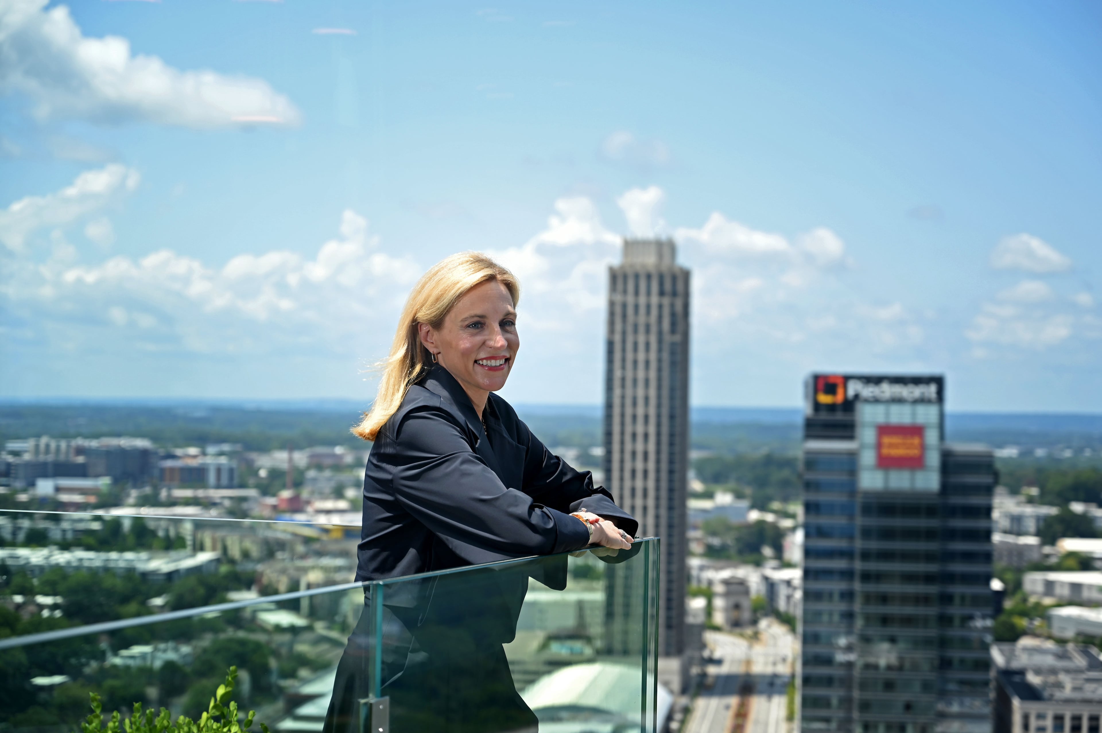 When SunTrust merged with BB&T in 2019 and became Truist, headquartered in North Carolina, Allison Dukes chose to stay in Atlanta. She said she did so in part because she was born here and her parents and grandparents lived here. A year later Dukes took a job with Atlanta-based Invesco. (Hyosub Shin/AJC)