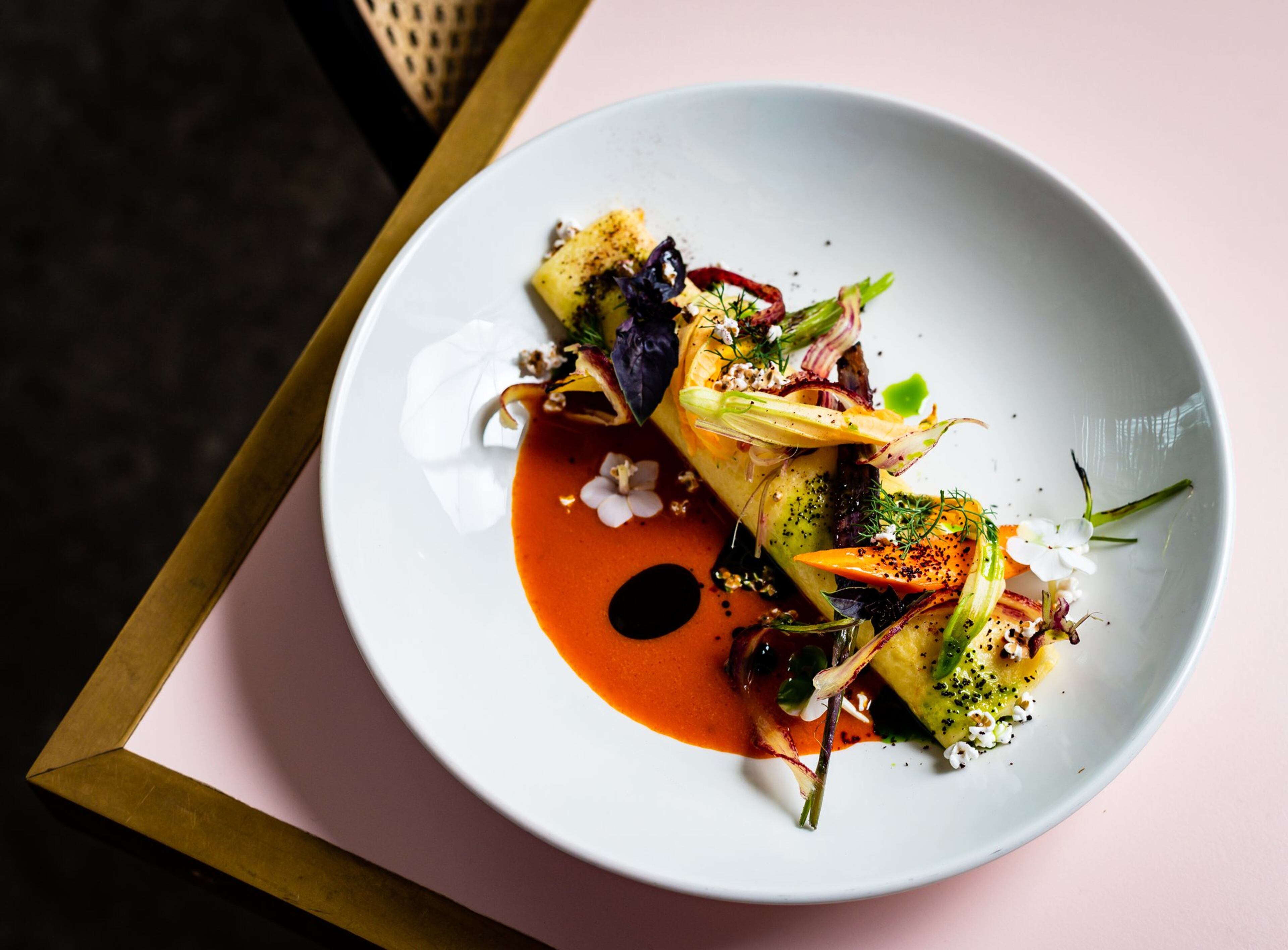 The Bechamel Comte Crepe with Sorghum Vinaigrette and Pistachio Oil at Tiny Lou’s is from chef Jeb Aldrich. He has an appreciation for classic sauces such as bechamel. CONTRIBUTED BY HENRI HOLLIS