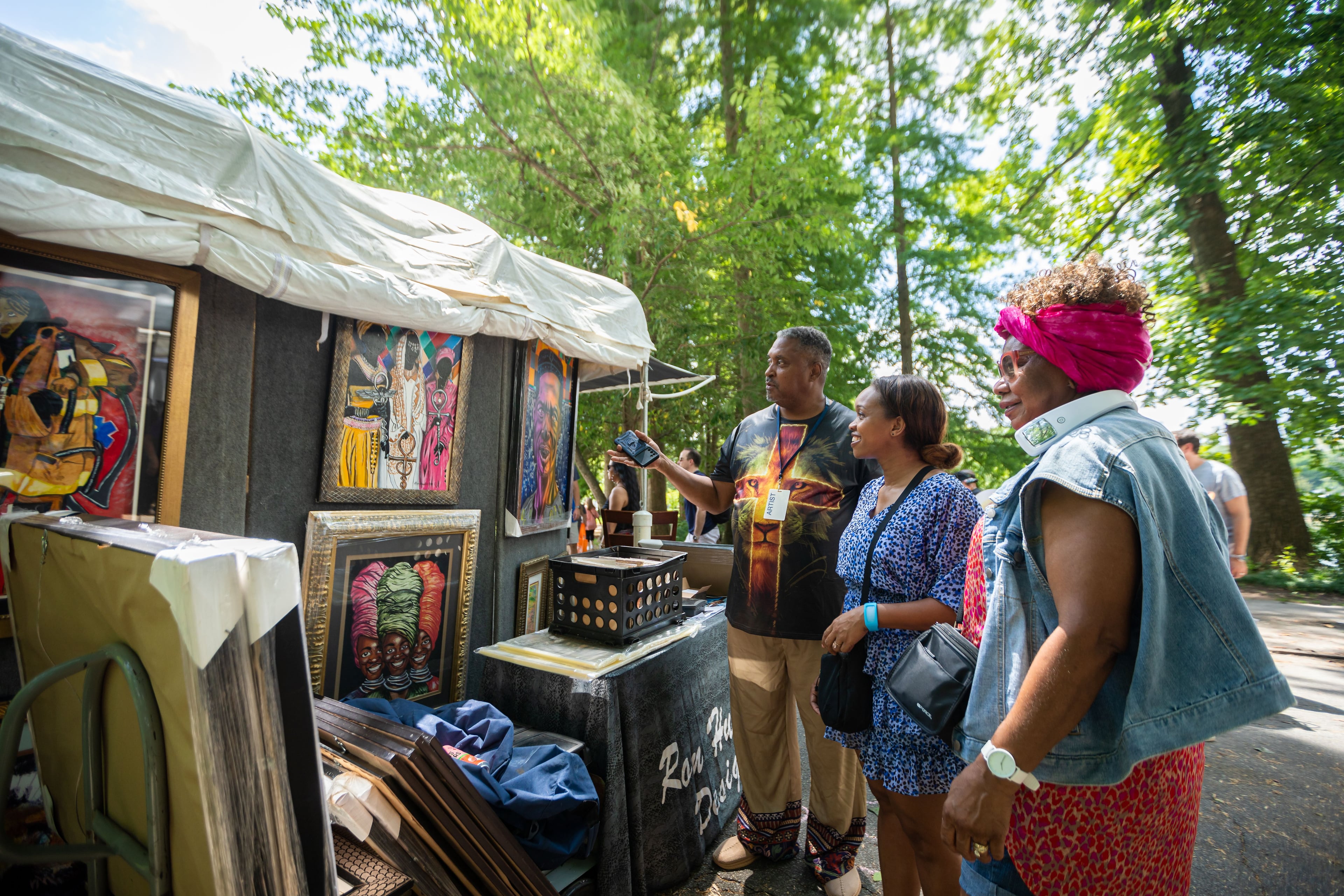 Attendees look at artwork at the Piedmont Park Arts Festival in 2024. (Courtesy of Ben Dashwood)