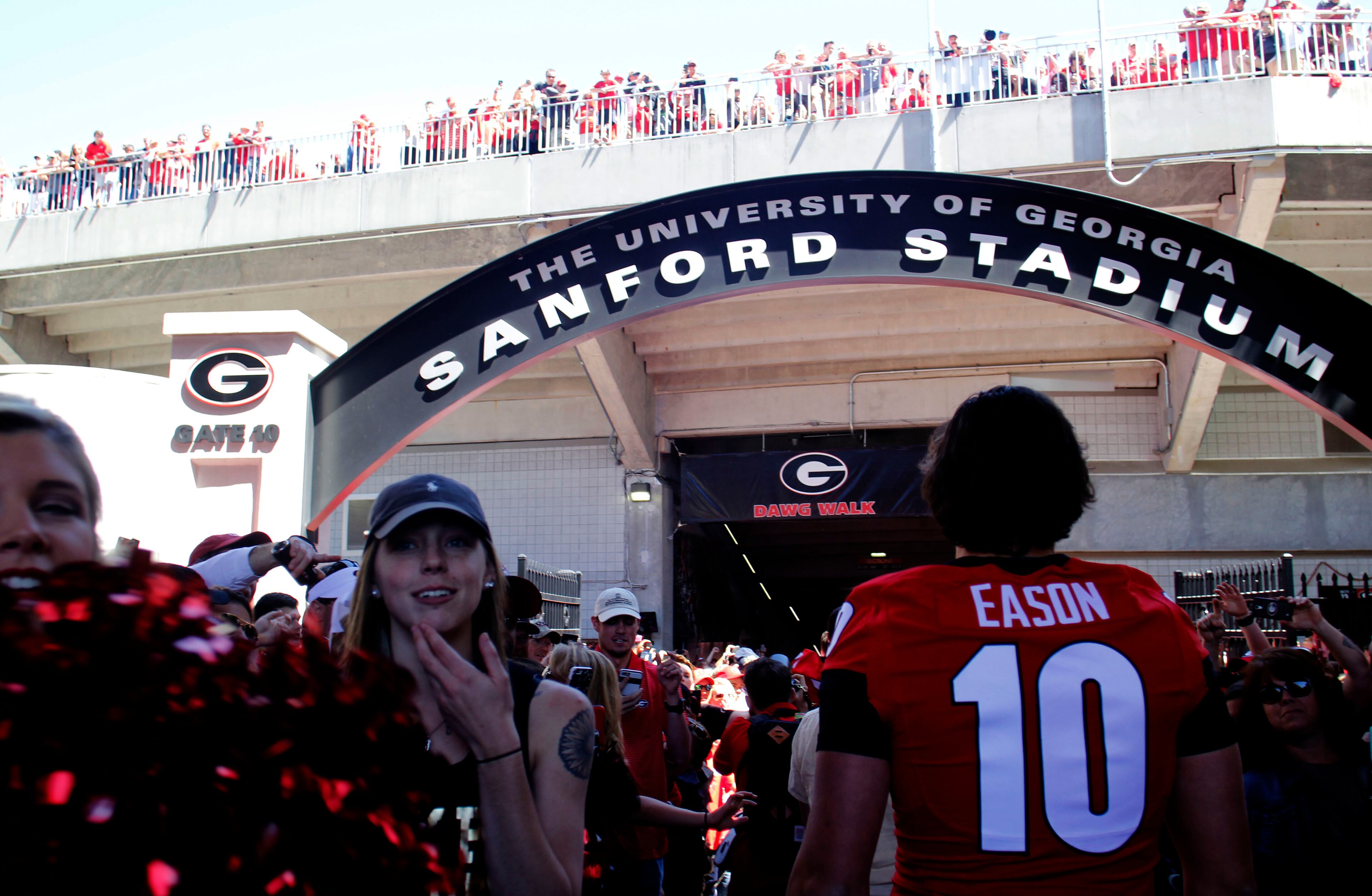 Georgia quarterback Jacob Eason (10) enters Sanford Stadium before the G-Day game. TAYLOR CARPENTER / TAYLOR.CARPENTER@AJC.COM