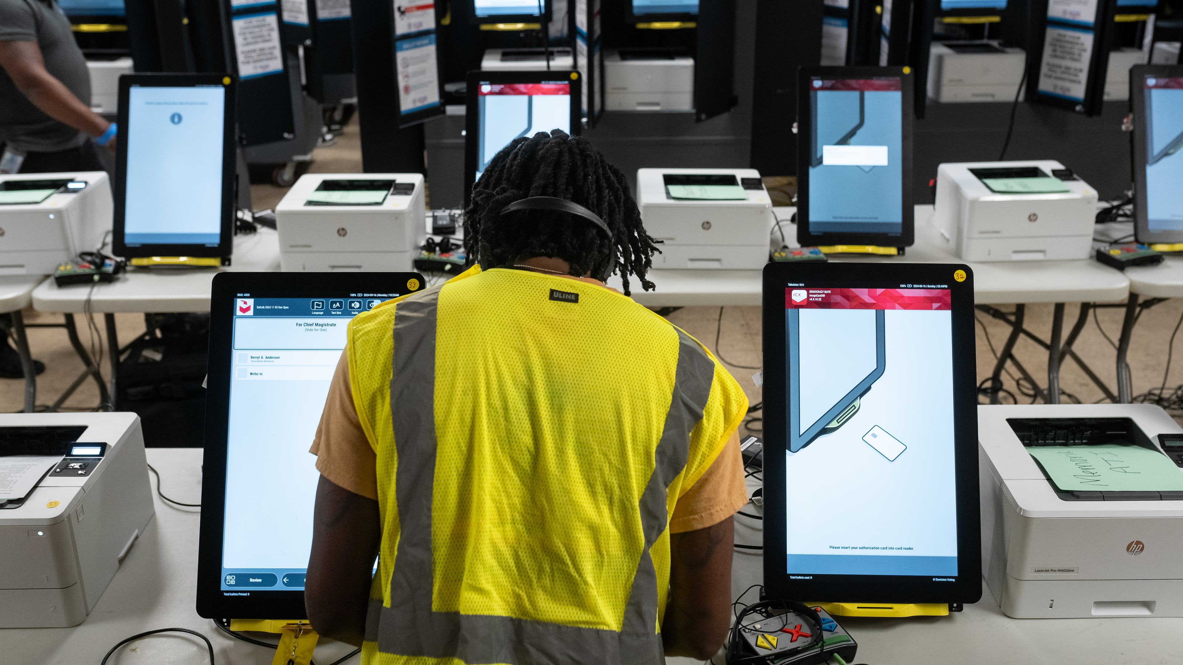 Dekalb County Elections officals conduct logic and accuracy testing of Dominion voting machines in September. (Ben Hendren for The Atlanta Journal-Constitution)