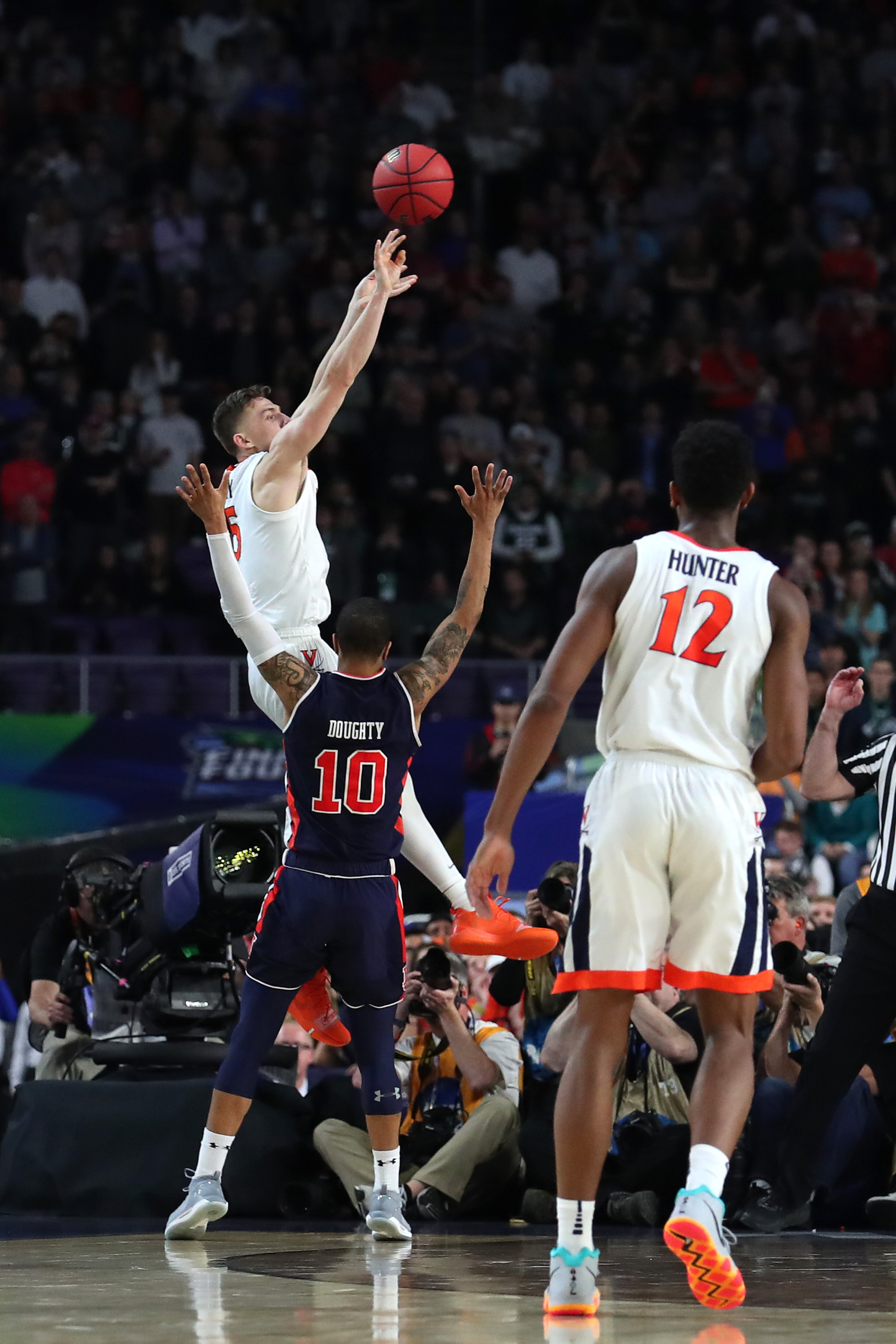 With his team down by two points, Kyle Guy of Virginia attempted a three-pointer as time expired. A foul was called on Auburn's Samir Doughty. Guy made all three free throws and the Cavs advanced to the national championship game. (Photo by Tom Pennington/Getty Images)