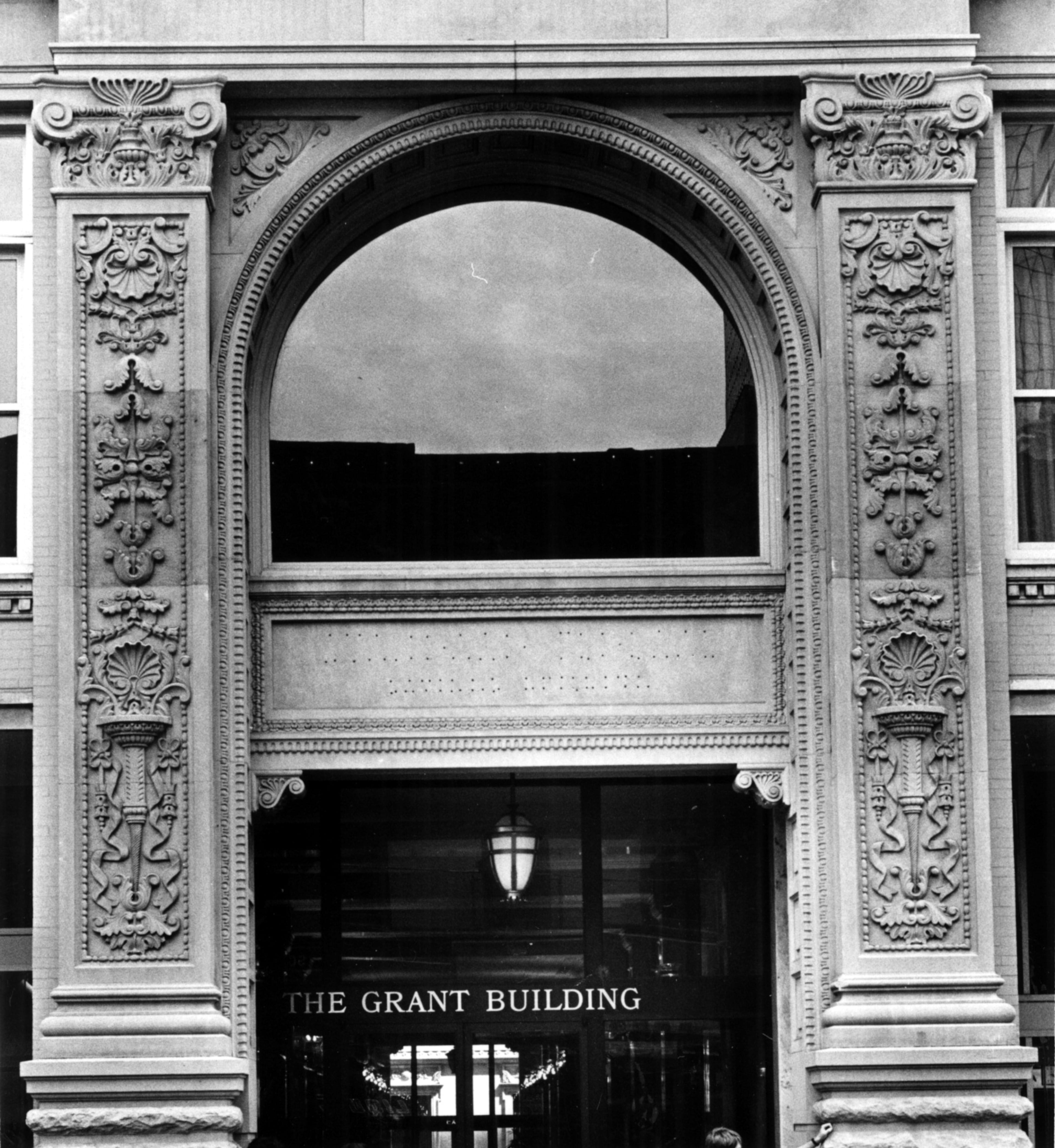 May, 8, 1981 Grant-Prudential Building, 44 Broad Street NW, Bruce and Morgan, Architects 1898, Entered in the National Register of Historic Places, January, 1979. Narrow, vertical piers and large, horizontal banks of window spaces clearly reveal the steel-cage construction of the building. The ten-story structure was the second skyscraper in Atlanta known to be fully steel-franmed. As such, it was a progenitor of a new era of skyscraper construction in the city. It was also the first building in Atlanta to occupy a full city block. Now known as the W.D. Grant Building, the structure received an Award of Excellence from the Urban Design Commission for its rehabilitation and preservation. Arched entryway into Grant Building. (Bud Skinner/AJC Staff) 1981