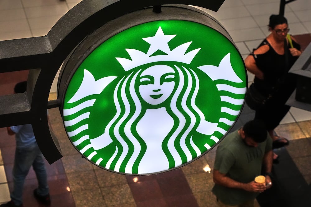 A Starbucks sign is displayed in the Galleria Mall in Buffalo, New York, in August. (Gene J. Puskar/AP)