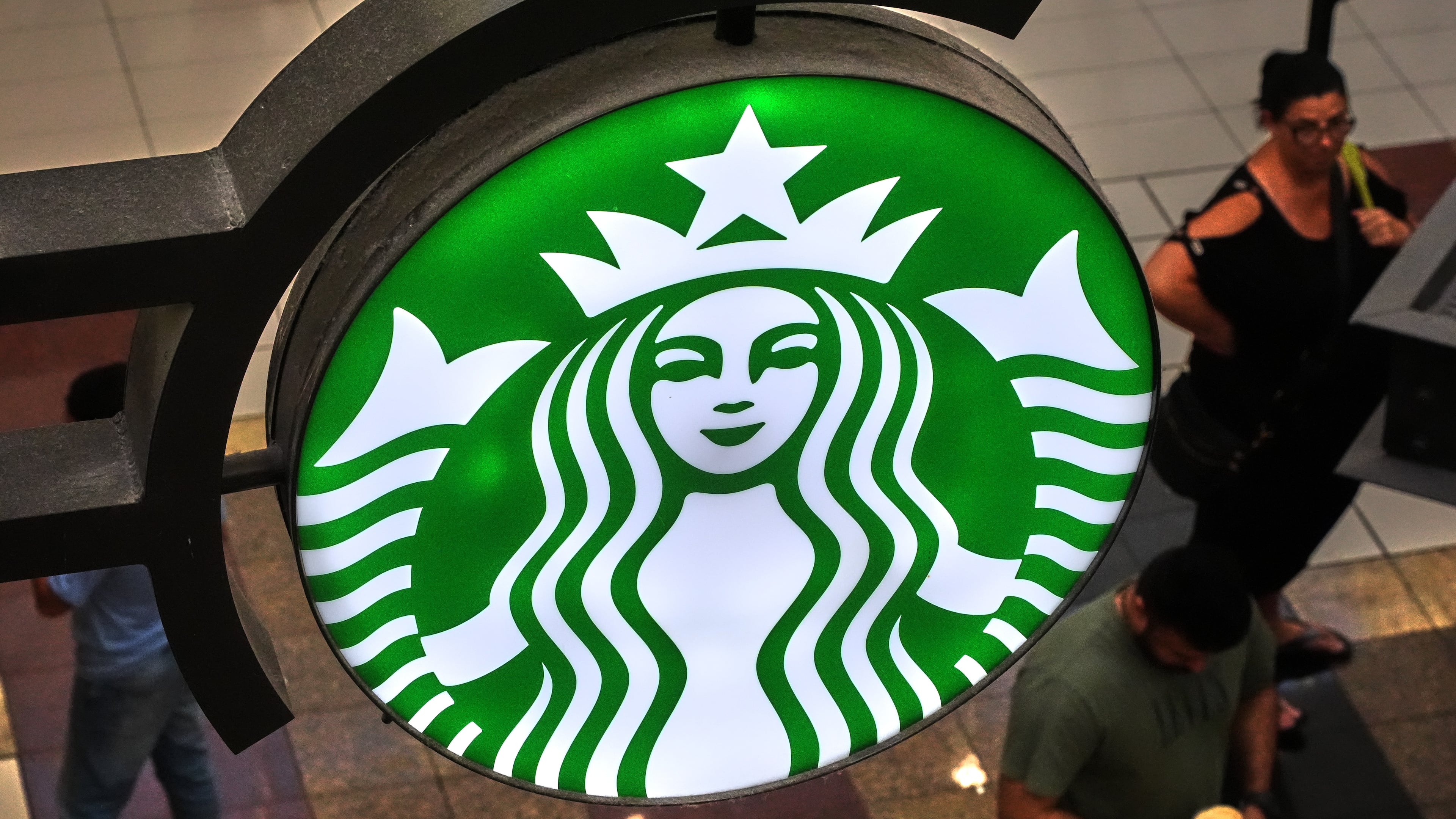 FILE - A Starbucks sign is displayed in the Galleria Mall in Buffalo, N.Y., Wednesday, Aug. 26, 2026. (AP Photo/Gene J. Puskar, File)