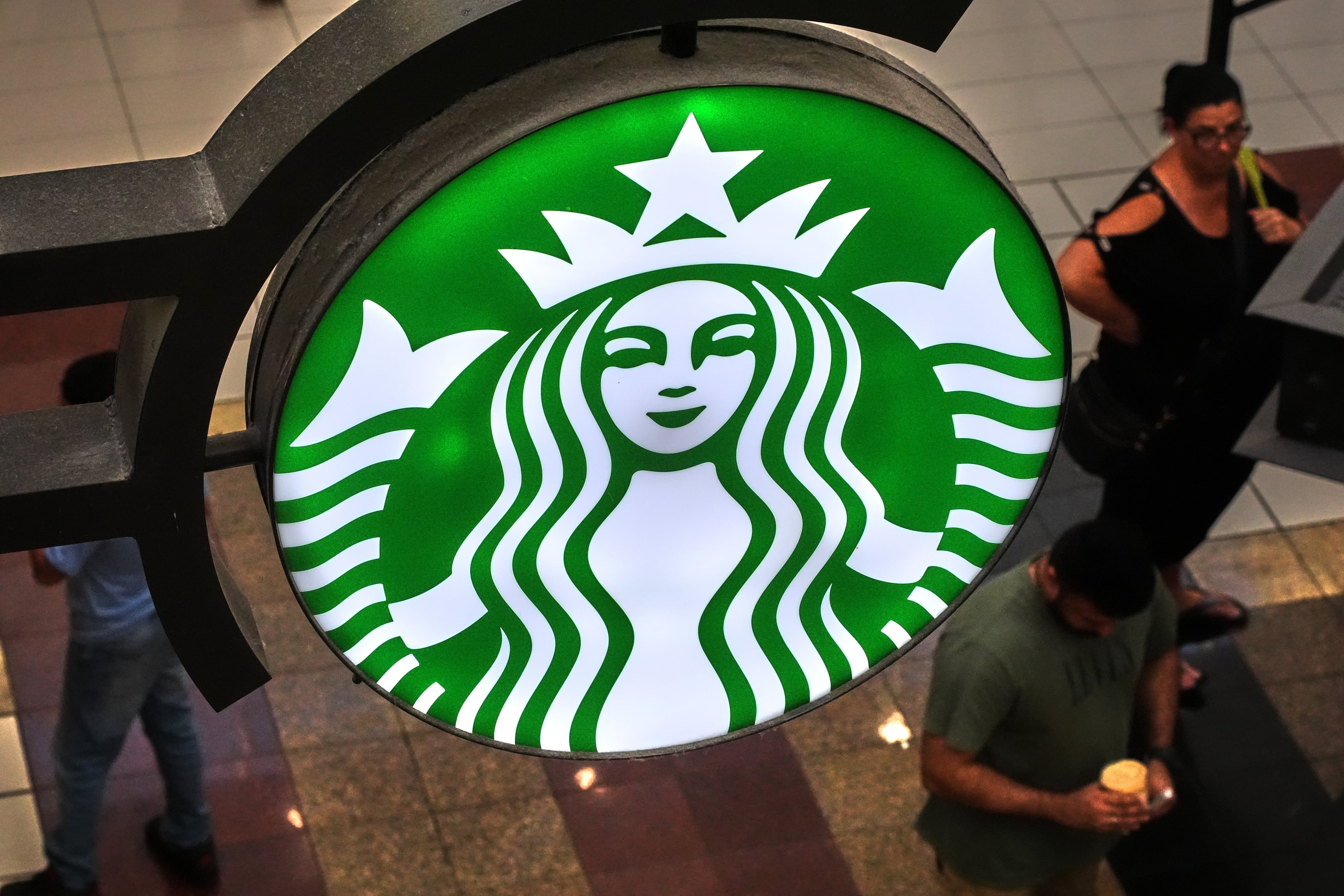 A Starbucks sign is displayed in the Galleria Mall in Buffalo, New York, in August. (Gene J. Puskar/AP)