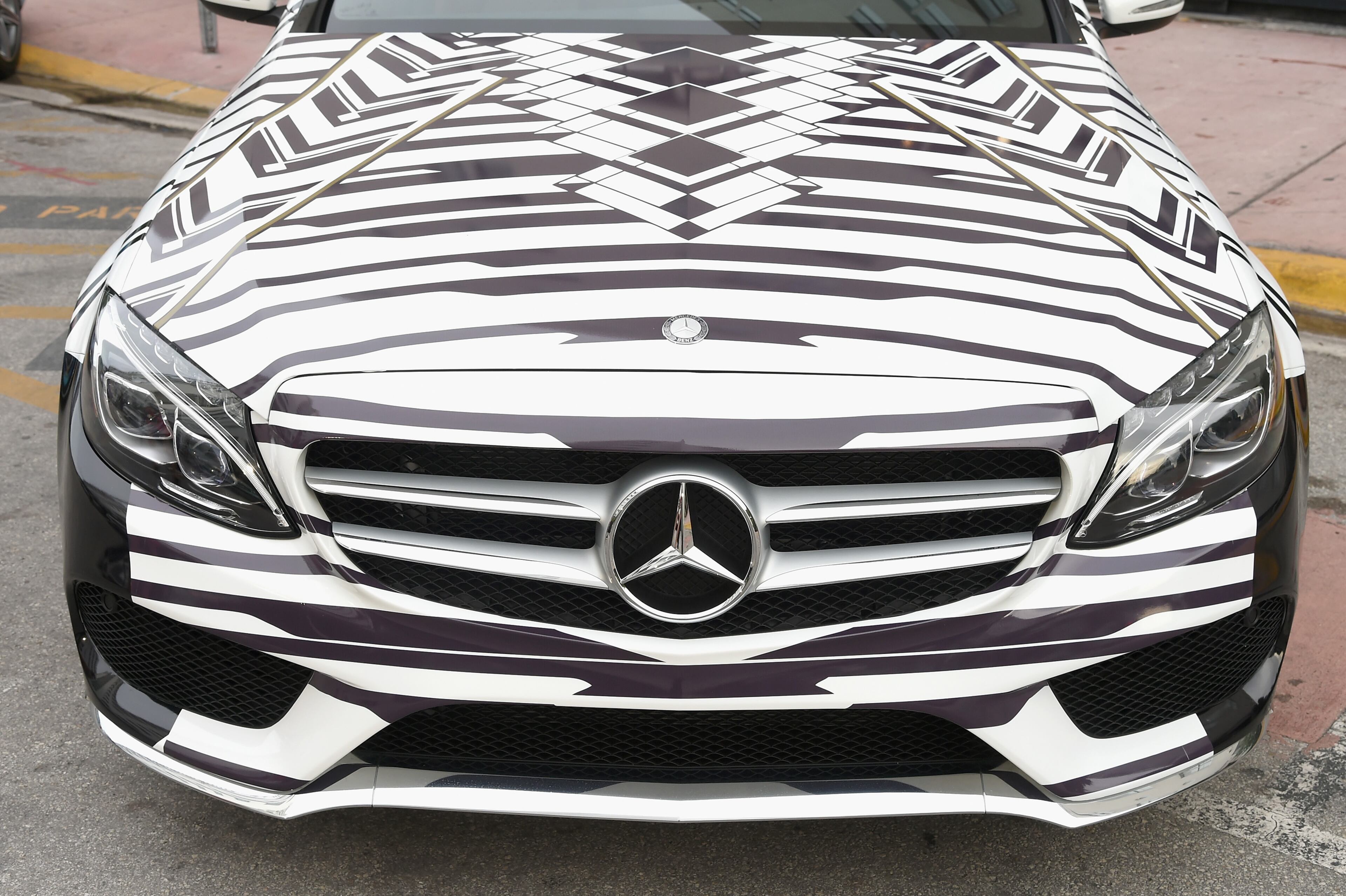 MIAMI BEACH, FL - JULY 17: A 2015 Mercedes-Benz C-Class featuring an exclusive design by Red Carter on display during Mercedes-Benz Fashion Week Swim 2015 at The Raleigh on July 17, 2014 in Miami Beach, Florida. (Photo by Andrew H. Walker/Getty Images for Mercedes-Benz Fashion Week )