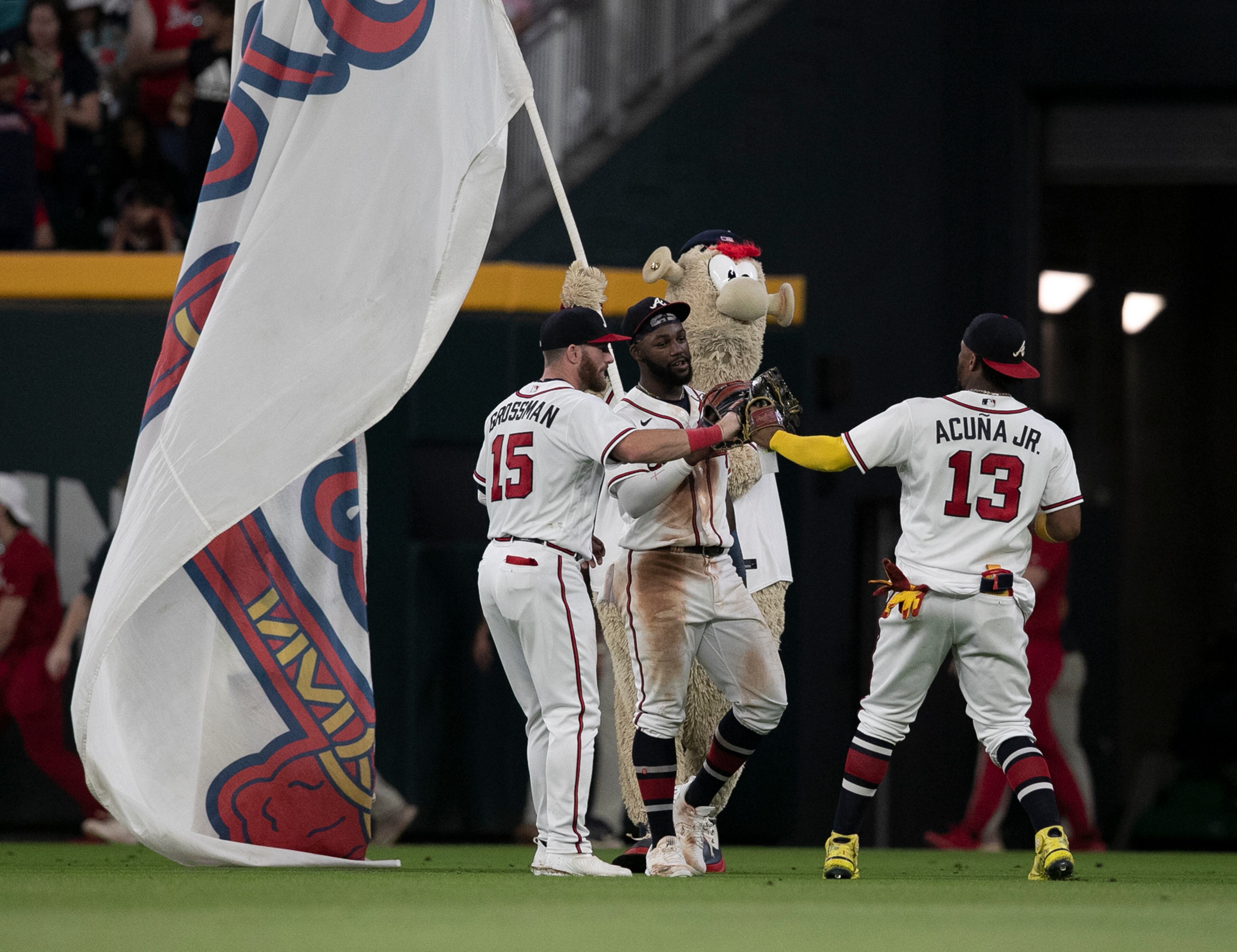 Braves outfielders (from left) Robbie Grossman, Michael Harris and Ronald Acuna celebrate a 3-2 victory over the Washington Nationals on Tuesday, Sept. 20, 2022, in Atlanta. “Curtis Compton / Curtis Compton@ajc.com