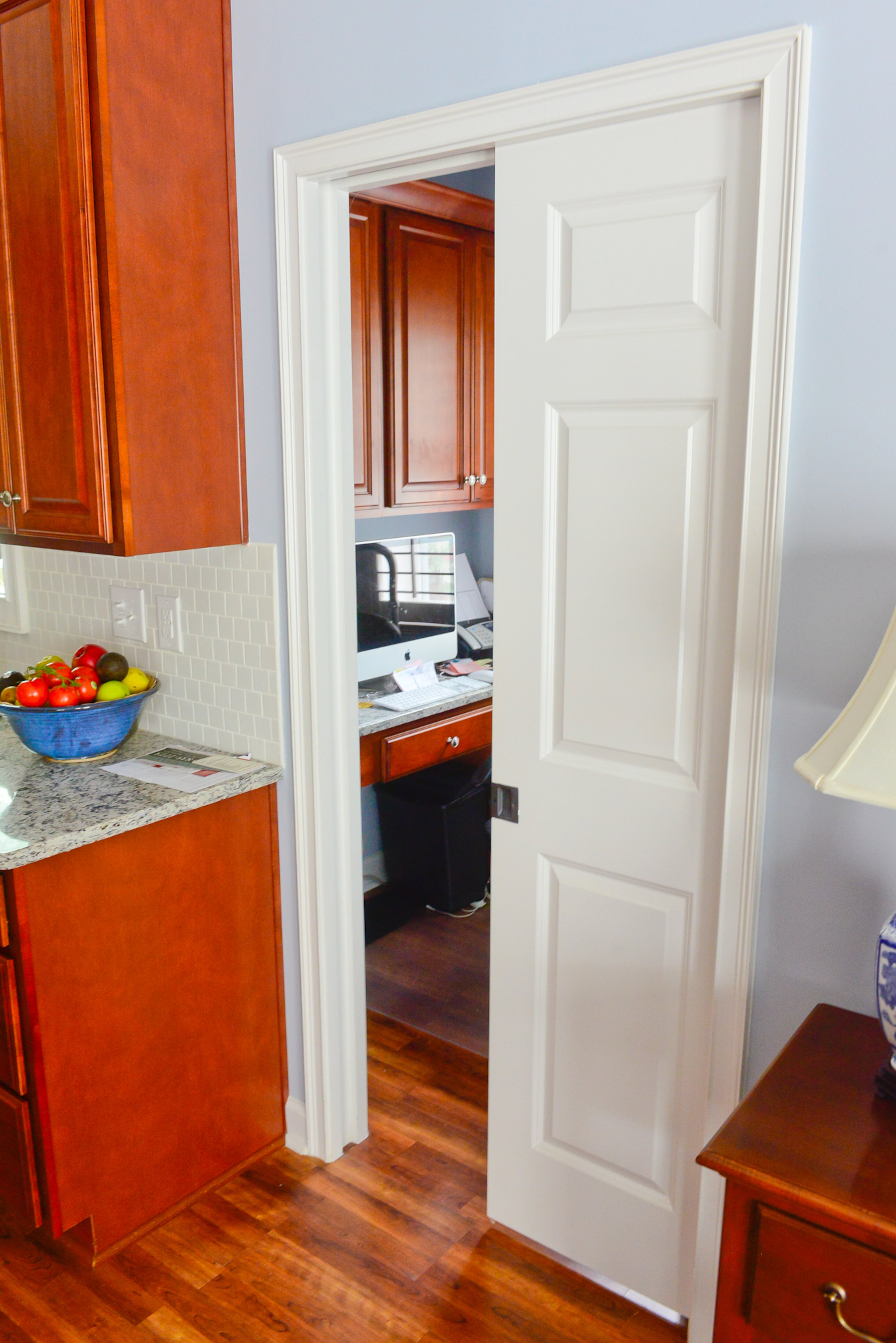 This handy pocket door was installed between the kitchen and the office when the home was built in 2005. Retirees Linda and Chris Clark like that their Stone Mountain home will be easy to grow old in with a walk-in shower, ground-level entrance in the back and wide doorways.
