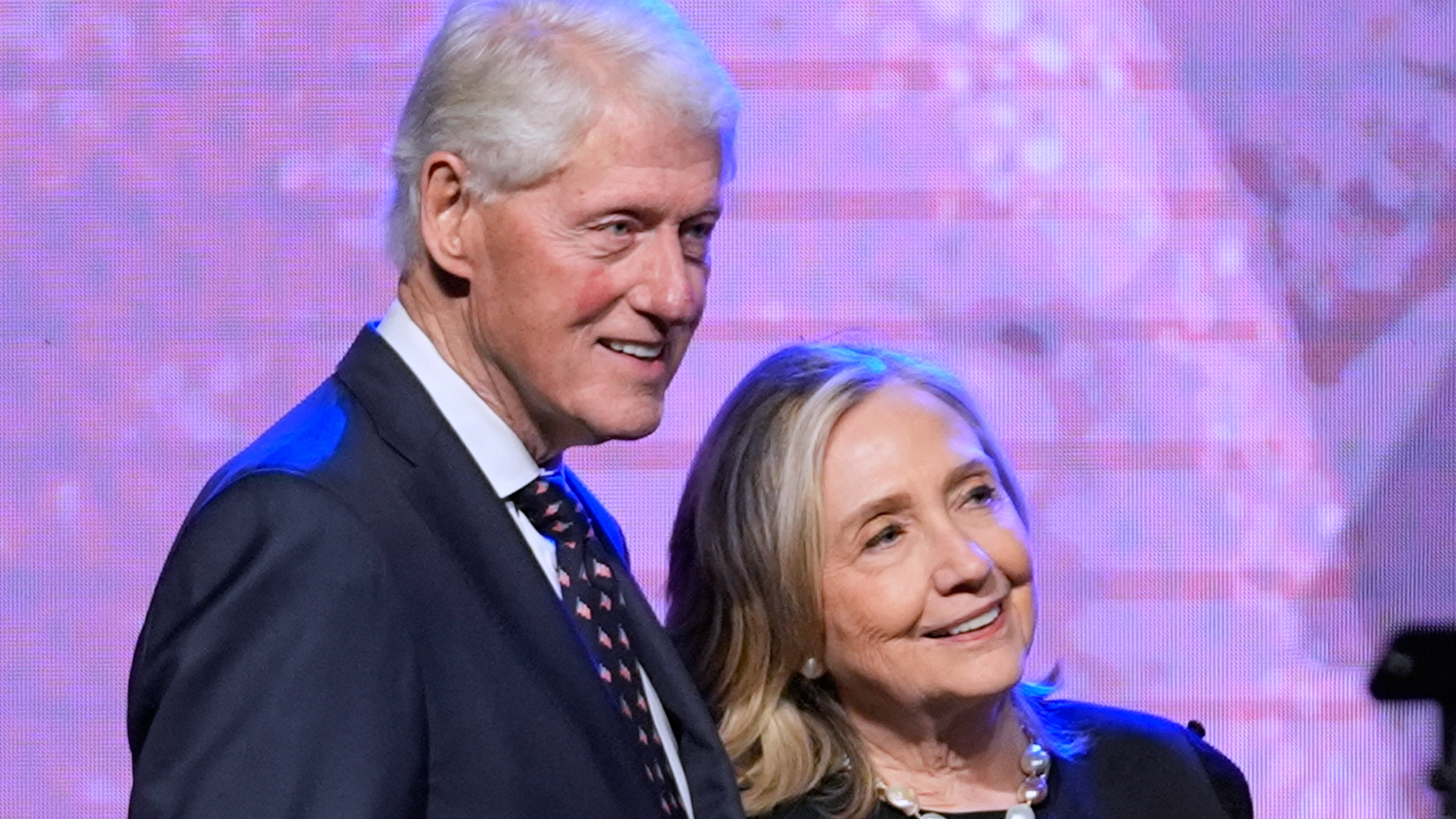 FILE - Former President Bill Clinton, left, and former Secretary of State Hillary Clinton listen as Vice President Kamala Harris delivers a eulogy for U.S. Rep. Sheila Jackson Lee, Aug. 1, 2024, in Houston. (AP Photo/LM Otero, File)