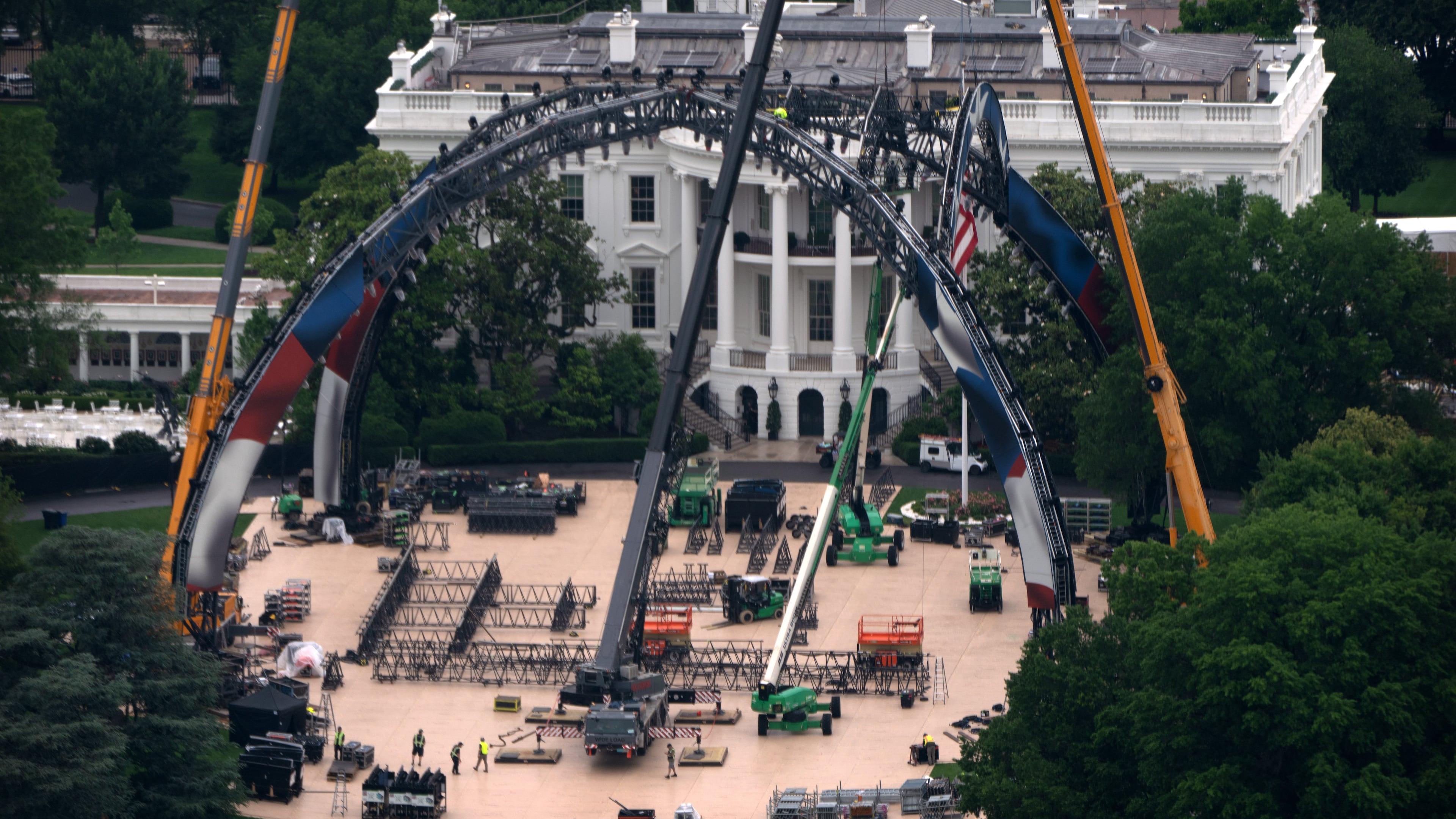 Equipment being placed on the South Lawn of the White House is seen from the Washington Monument, Tuesday, May 26, 2026, in Washington. The UFC is holding a mixed martial arts fight on June 14 as part of America 250 celebrations. (AP Photo/Mark Schiefelbein)