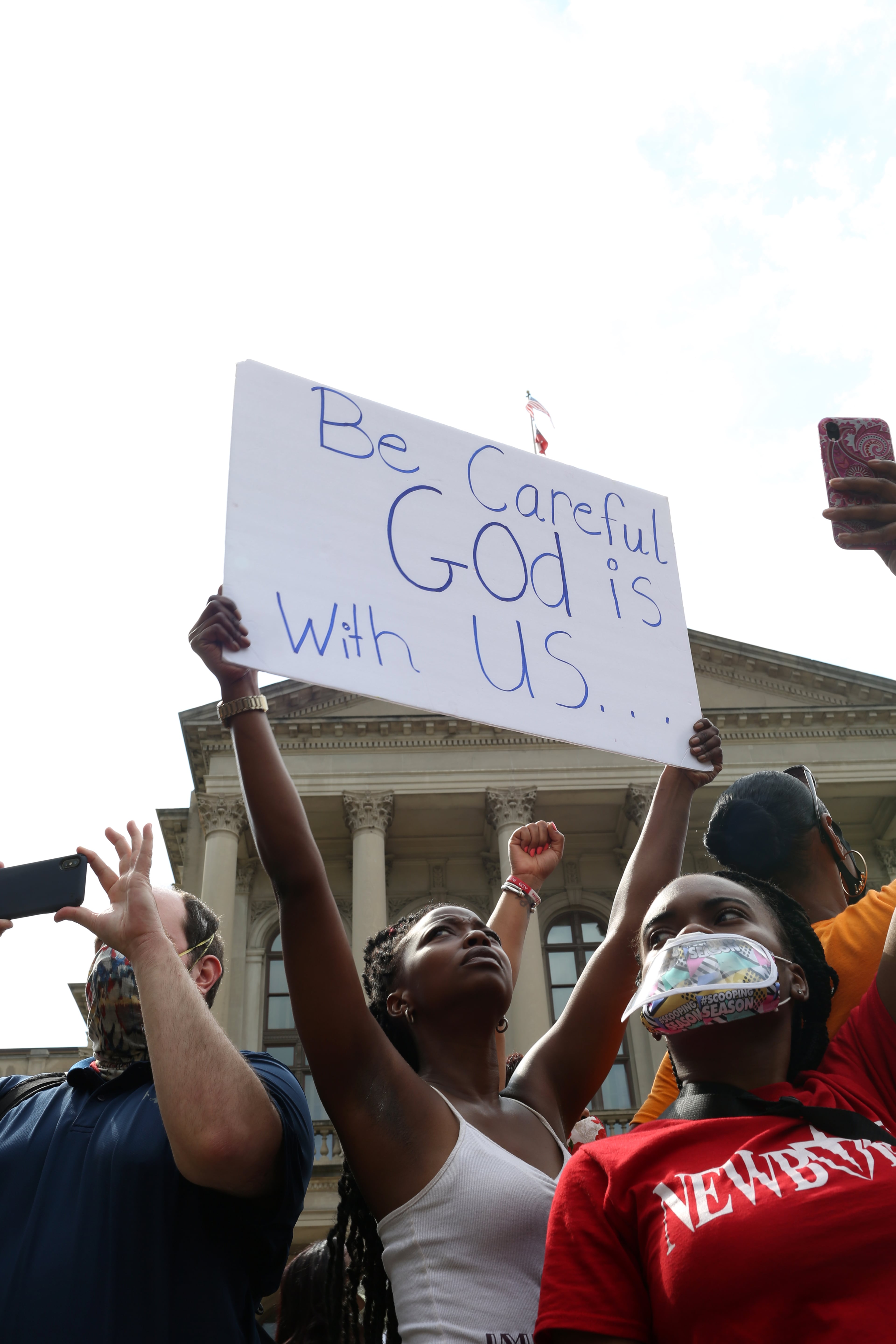 Brittany Holloway holds up a sign as protesters gather at the Georgia State Capitol building in downtown Atlanta for March on Georgia, a protest hosted by the Georgia chapter for the NAACP, on Monday, June 15, 2020. (REBECCA WRIGHT FOR THE ATLANTA JOURNAL-CONSTITUTION)
