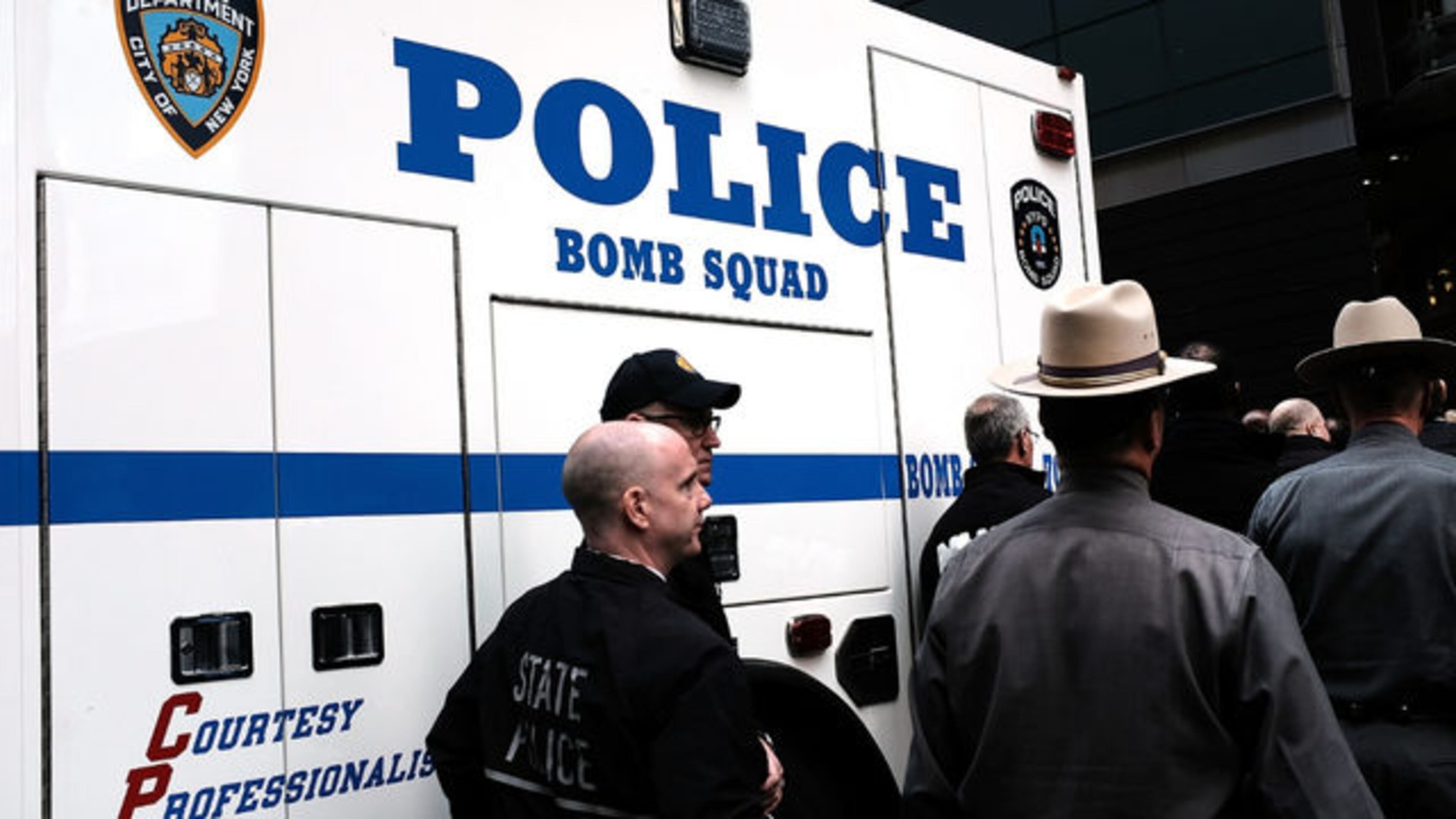 Police stand guard outside of the Time Warner Center after an explosive device was found there Wednesday in New York City. (Photo by Spencer Platt/Getty Images)