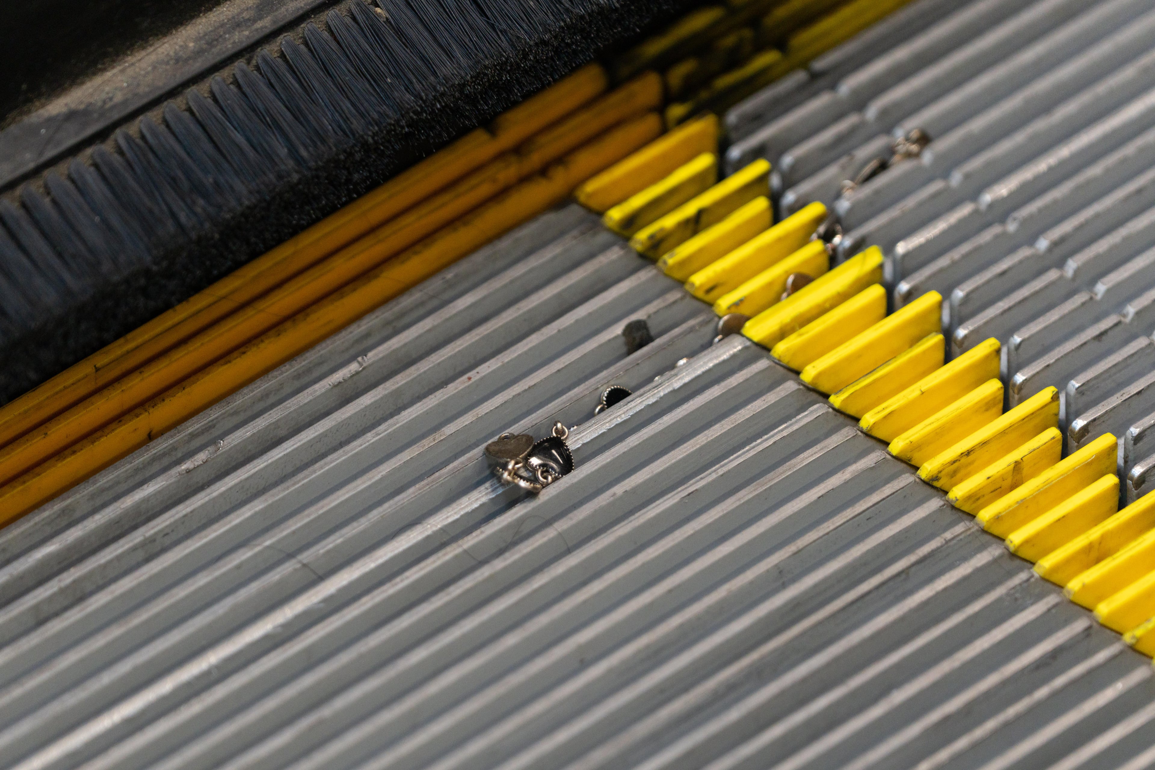 Broken jewelry left behind inside the Vine City MARTA station after 9 people were injured following a Beyoncé concert after an accident occurred with the station's escalator. Tuesday, July 15, 2025 (Ben Hendren for the AJC)