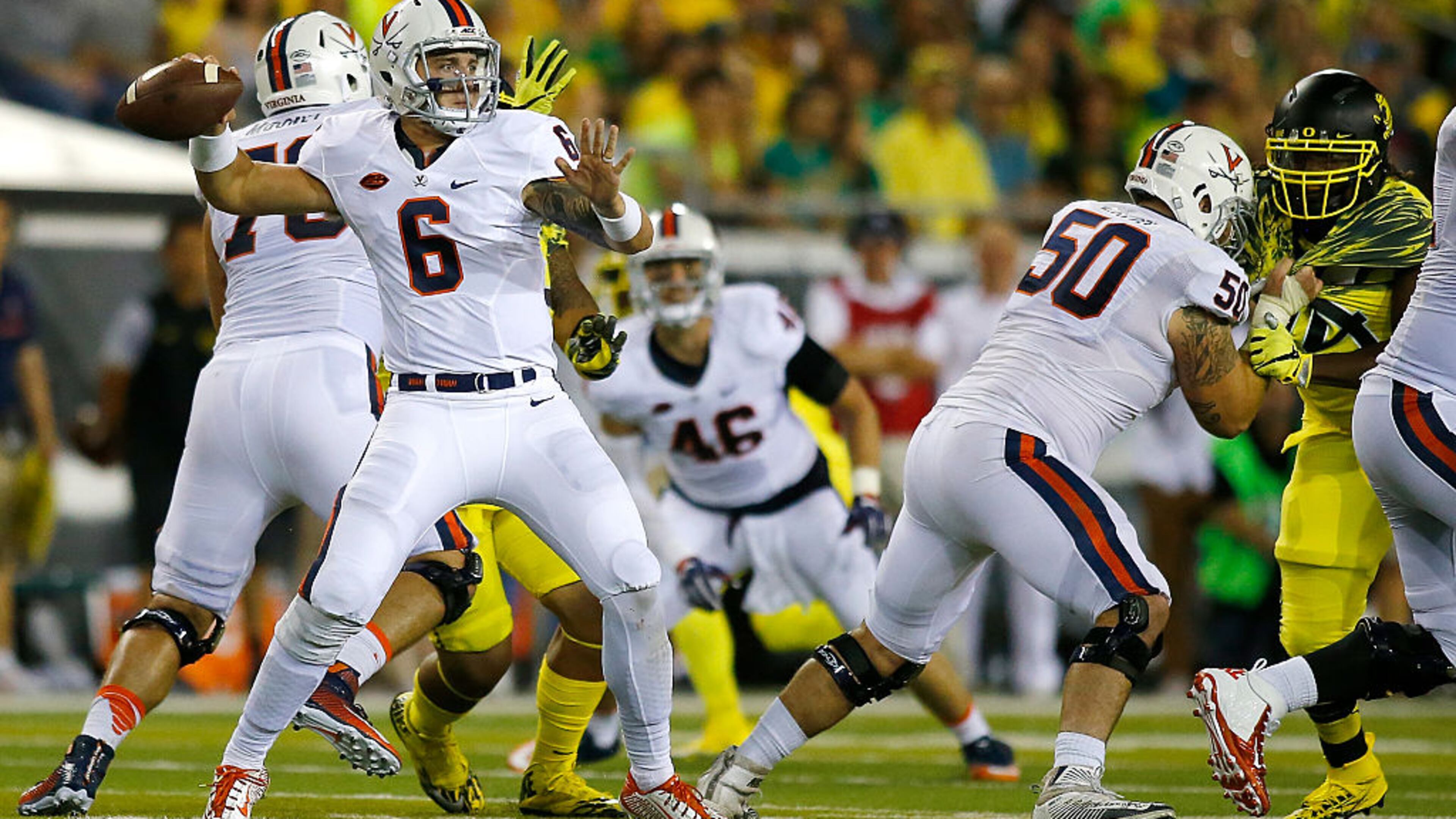 EUGENE, OR - SEPTEMBER 10: Kurt Benkert #6 of the Virginia Cavaliers throws the ball against the Oregon Ducks at Autzen Stadium on September 10, 2016 in Eugene, Oregon. (Photo by Jonathan Ferrey/Getty Images)