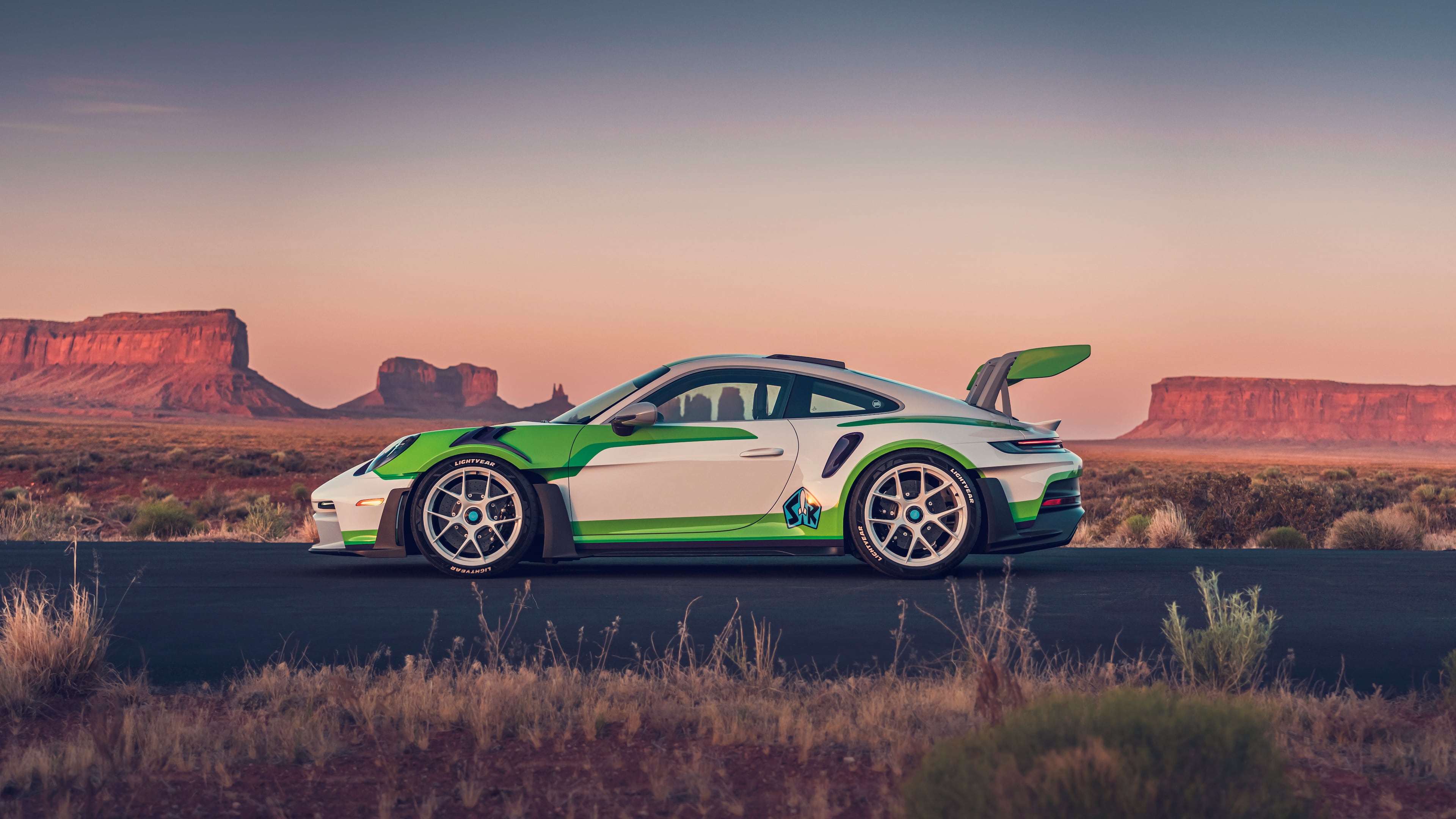The Buzz Lightyear-inspired 911 GT3 RS features a white, green and purple
color scheme, a rear wing echoing the character's signature “wings" and custom
“Lightyear” tires. (Courtesy of Porsche Cars North America)