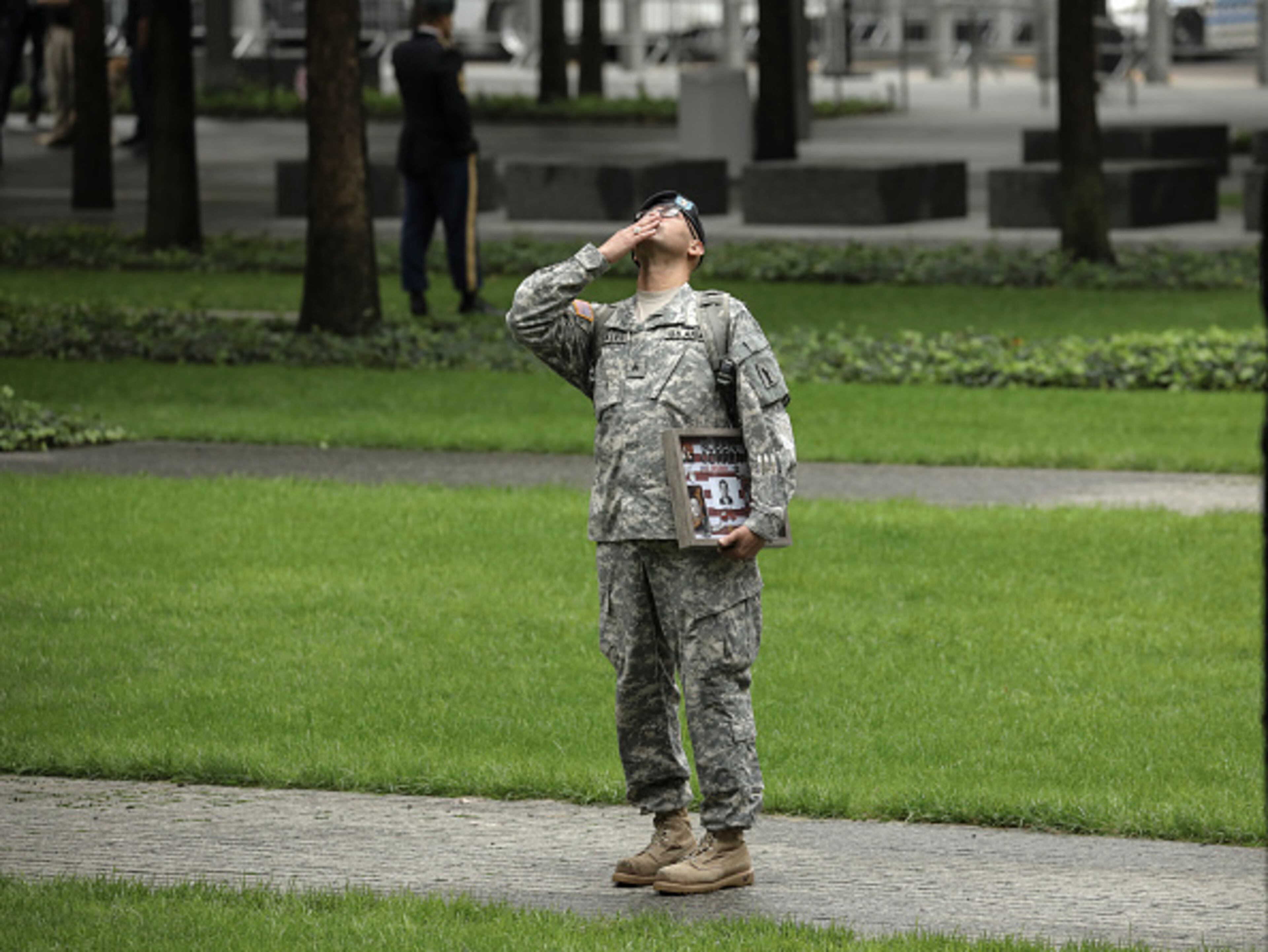 NEW YORK, NY - SEPTEMBER 11: Army Reserve Sgt. Edwin Morales blows a kiss skyward in memory of his late friend Ruben Correa, a firefighter who died in the 9/11 attacks, before the start of a commemoration ceremony for the victims of the September 11 terrorist attacks at the National September 11 Memorial, September 11, 2018 in New York City. In New York City and throughout the United States, the country is marking the 17th anniversary of the September 11 terrorist attacks. (Photo by Drew Angerer/Getty Images)