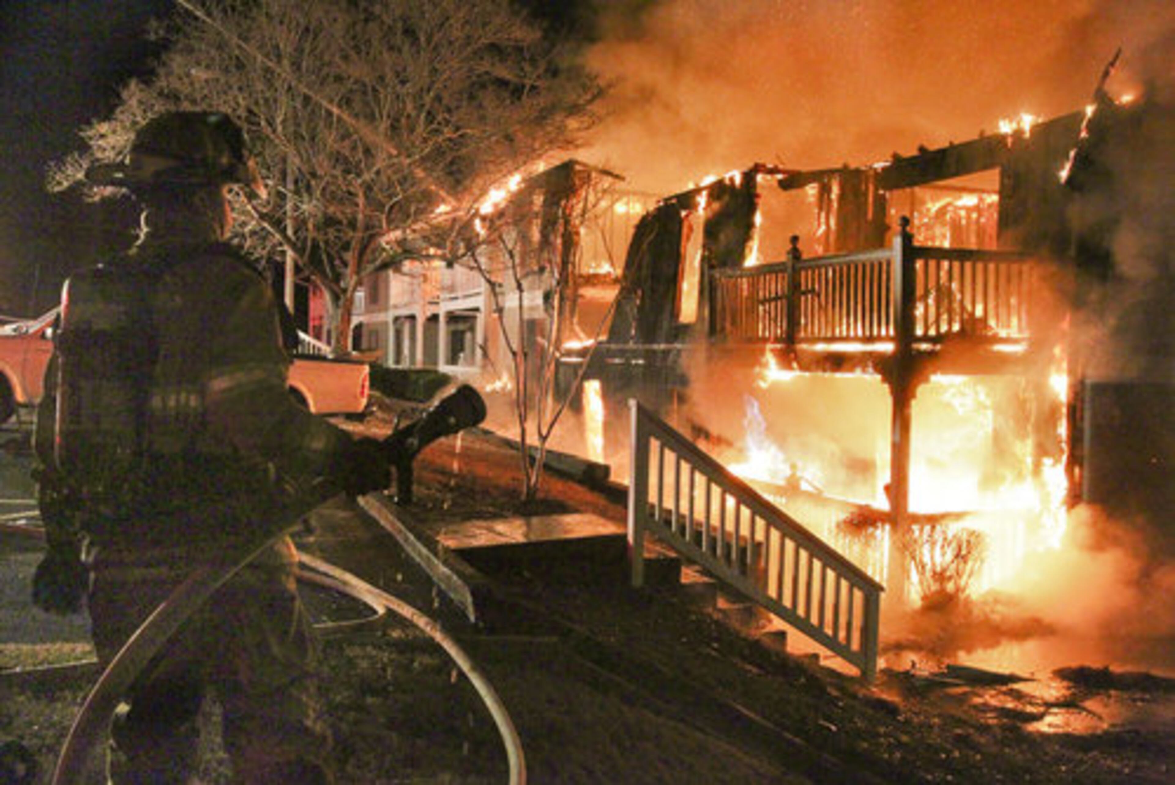 The fire broke out around 6 a.m.on Winterbrook Court. Gwinnett fire Capt. Thomas Rutledge said flames were shooting through the roof of the building when firefighters arrived.