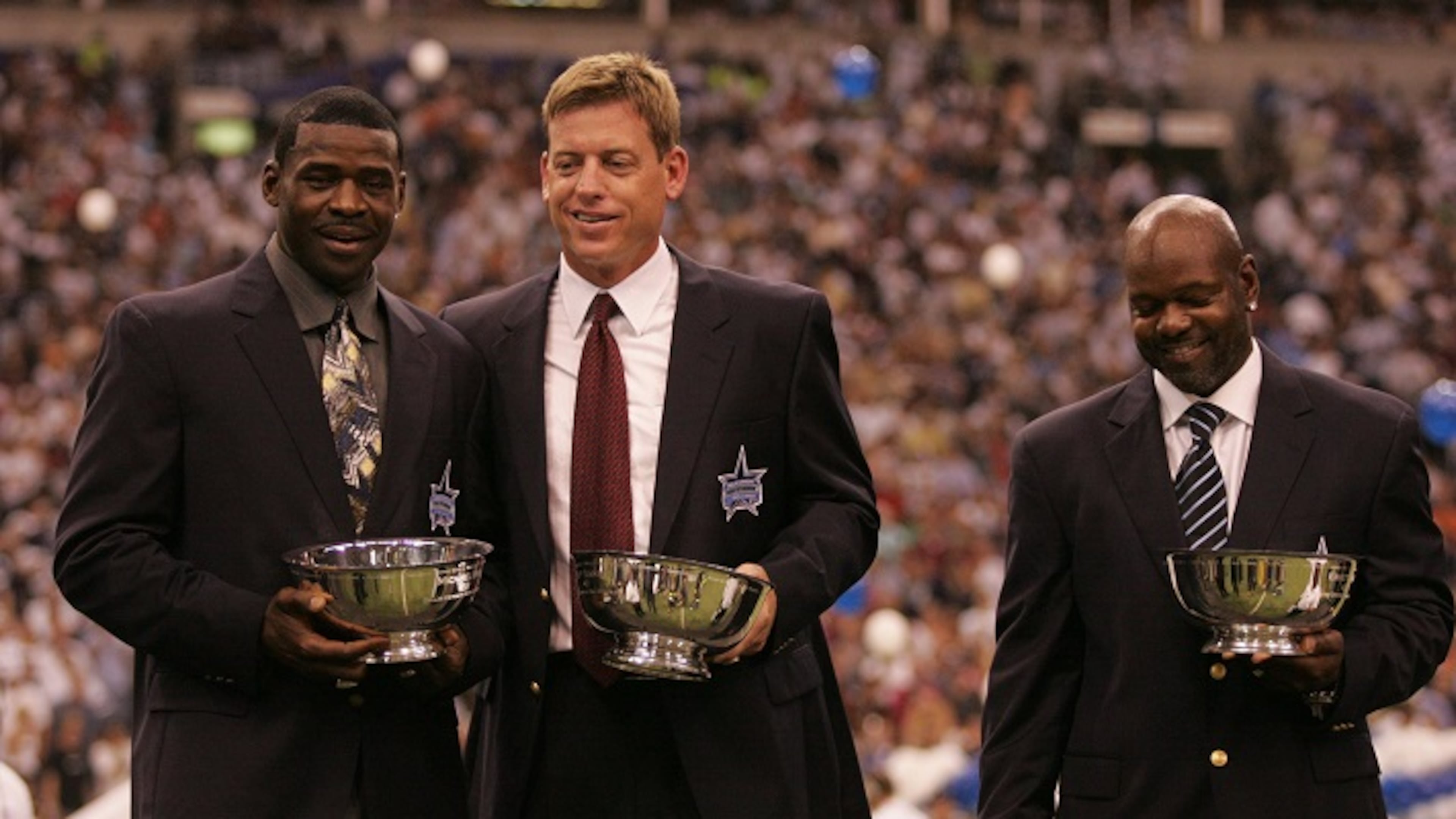 From left, Michael Irvin, Troy Aikman and Emmitt Smith at the Ring of Honor ceremony during halftime of a Dallas Cowboys game against the Washington Redskins at Texas Stadium in Irving, Texas, on September 19, 2005. (Tom Pennington/Fort Worth Star-Telegram/TNS)
