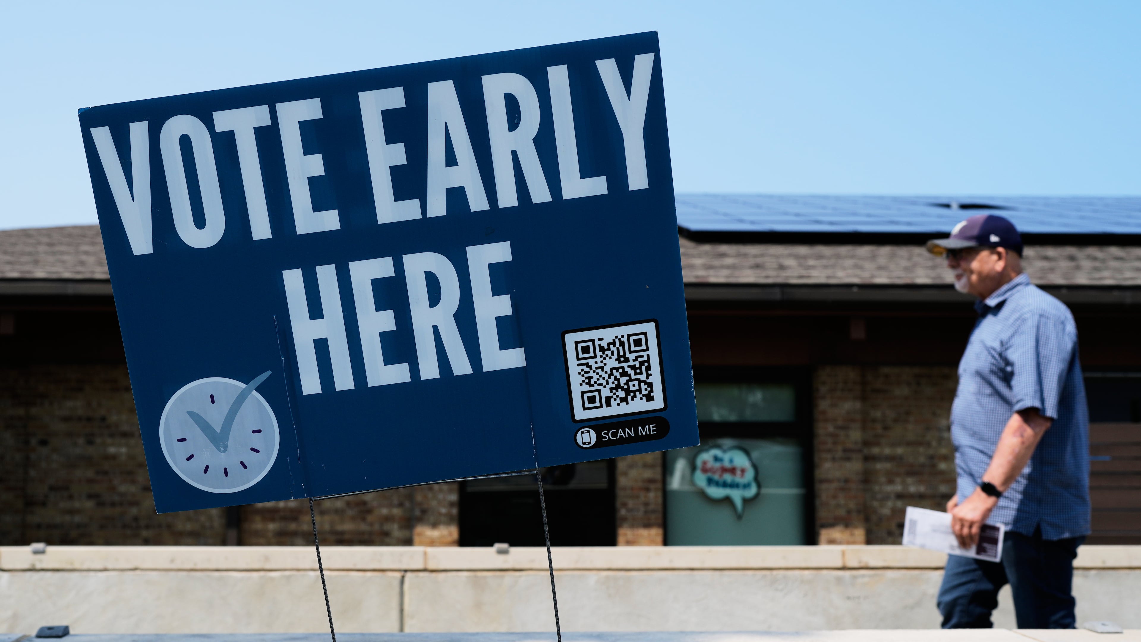 A voter walks to polling place in Milwaukee, Tuesday, July 28, 2026. (AP Photo/Nam Y. Huh)