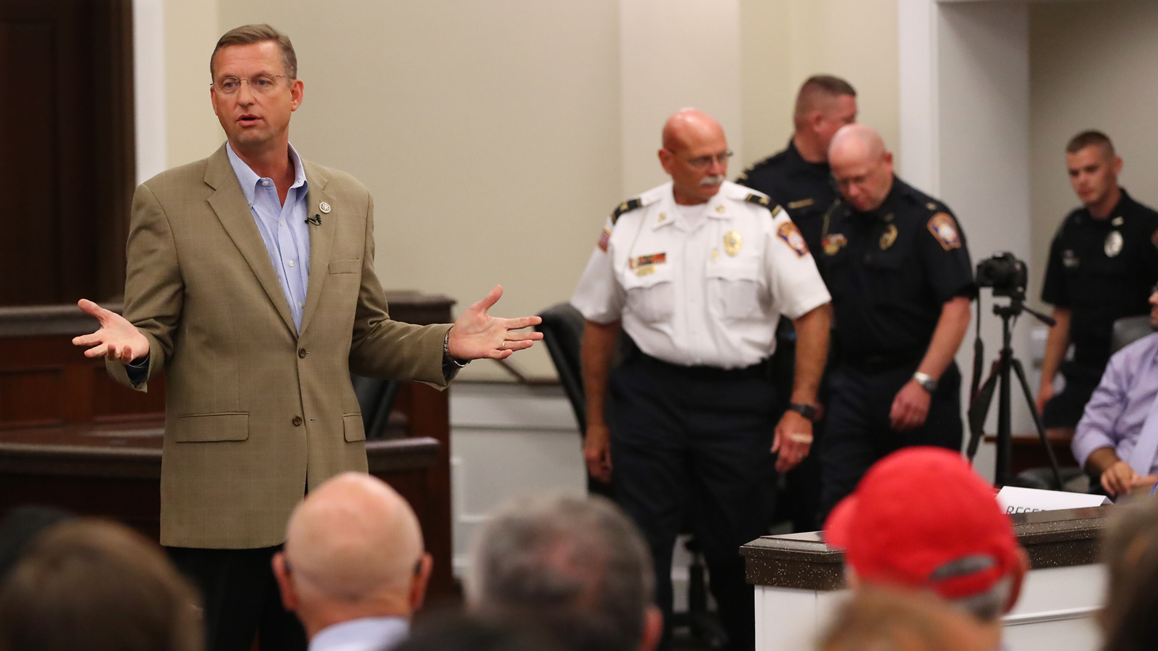 Rep. Doug Collins addresses a mix of demonstrators and supporters at a town hall in Gainesville. Curtis Compton/ccompton@ajc.com