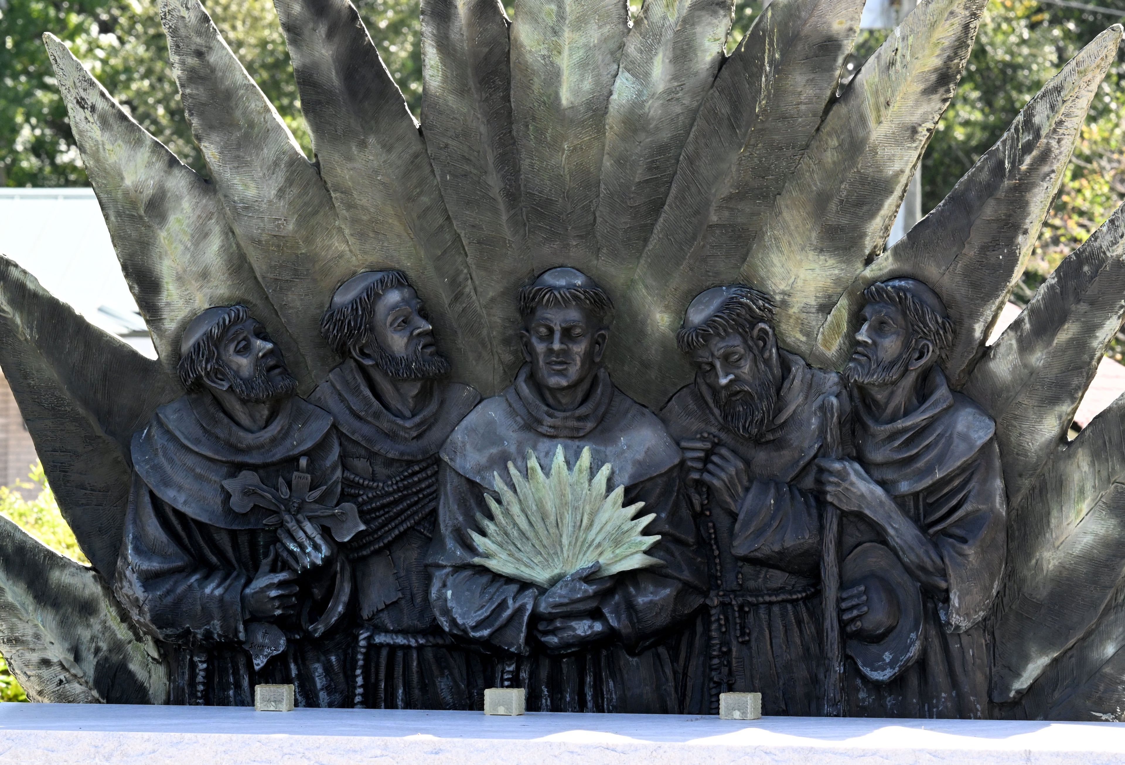 A sculpture of the Georgia Martyrs stands outside Nativity of Our Lady Catholic Church in Darien. (Hyosub Shin/AJC)