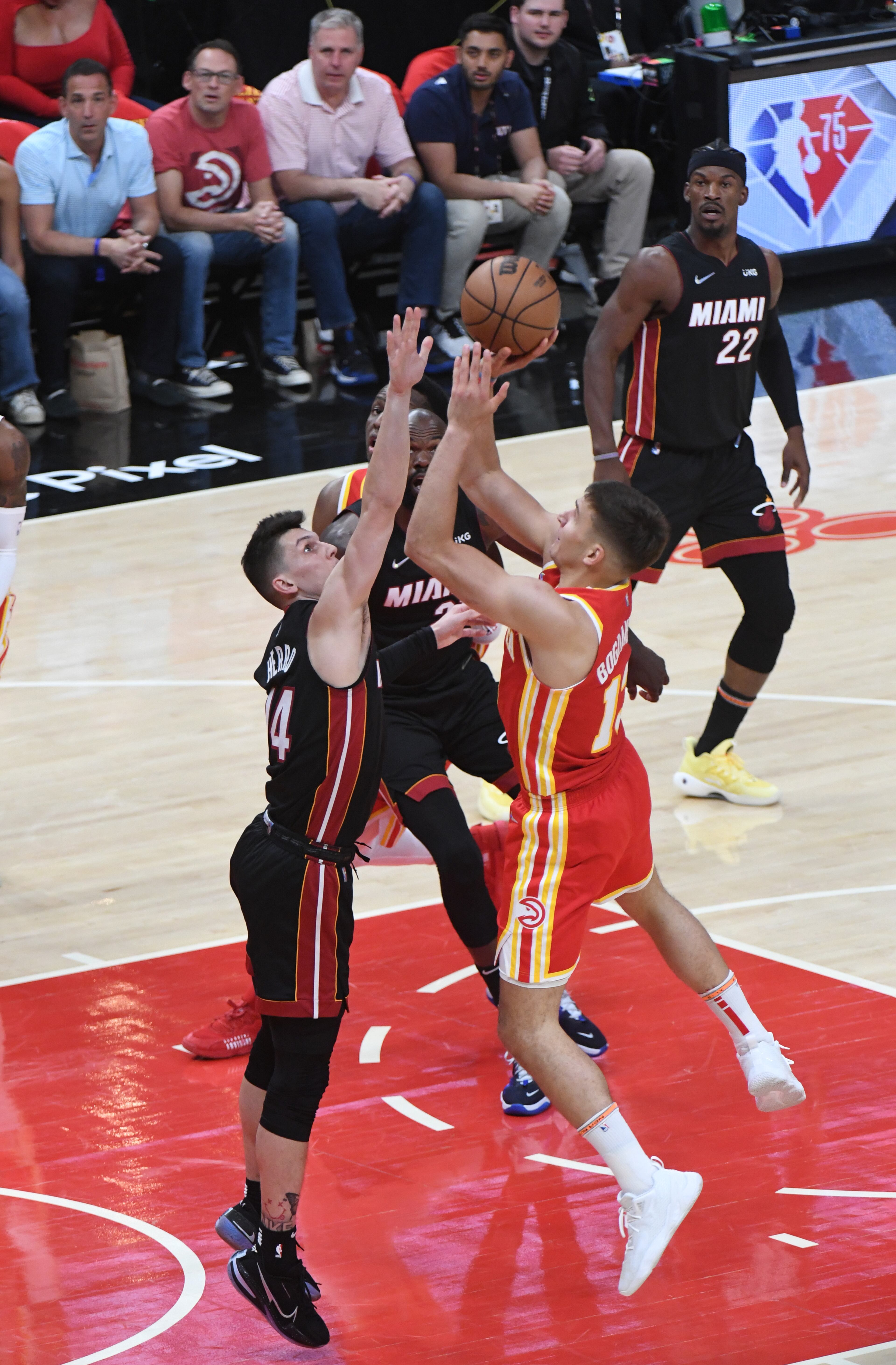 April 22, 2022 Atlanta - Atlanta Hawks' guard Bogdan Bogdanovic (13) shoots over Miami Heat's guard Tyler Herro (14) during the first half in Game 3 of the first round of the NBA playoffs at State Farm Arena on Friday, April 22, 2022. (Hyosub Shin / Hyosub.Shin@ajc.com)