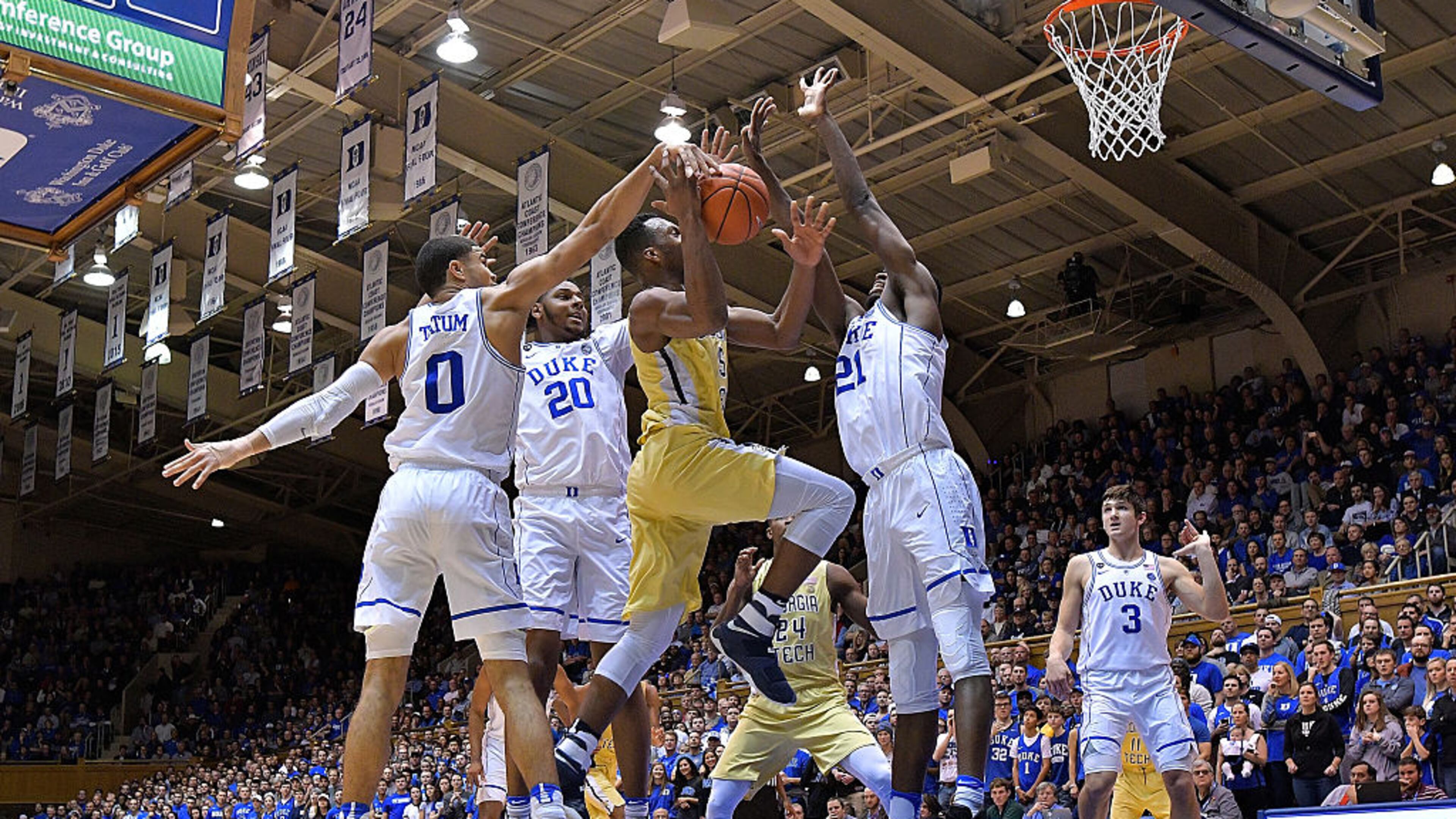 DURHAM, NC - JANUARY 04: Josh Okogie #5 of the Georgia Tech Yellow Jackets drives between Jayson Tatum #0, Marques Bolden #20 and Amile Jefferson #21 of the Duke Blue Devils during the game at Cameron Indoor Stadium on January 4, 2017 in Durham, North Carolina. Duke won 110-57. (Photo by Grant Halverson/Getty Images)