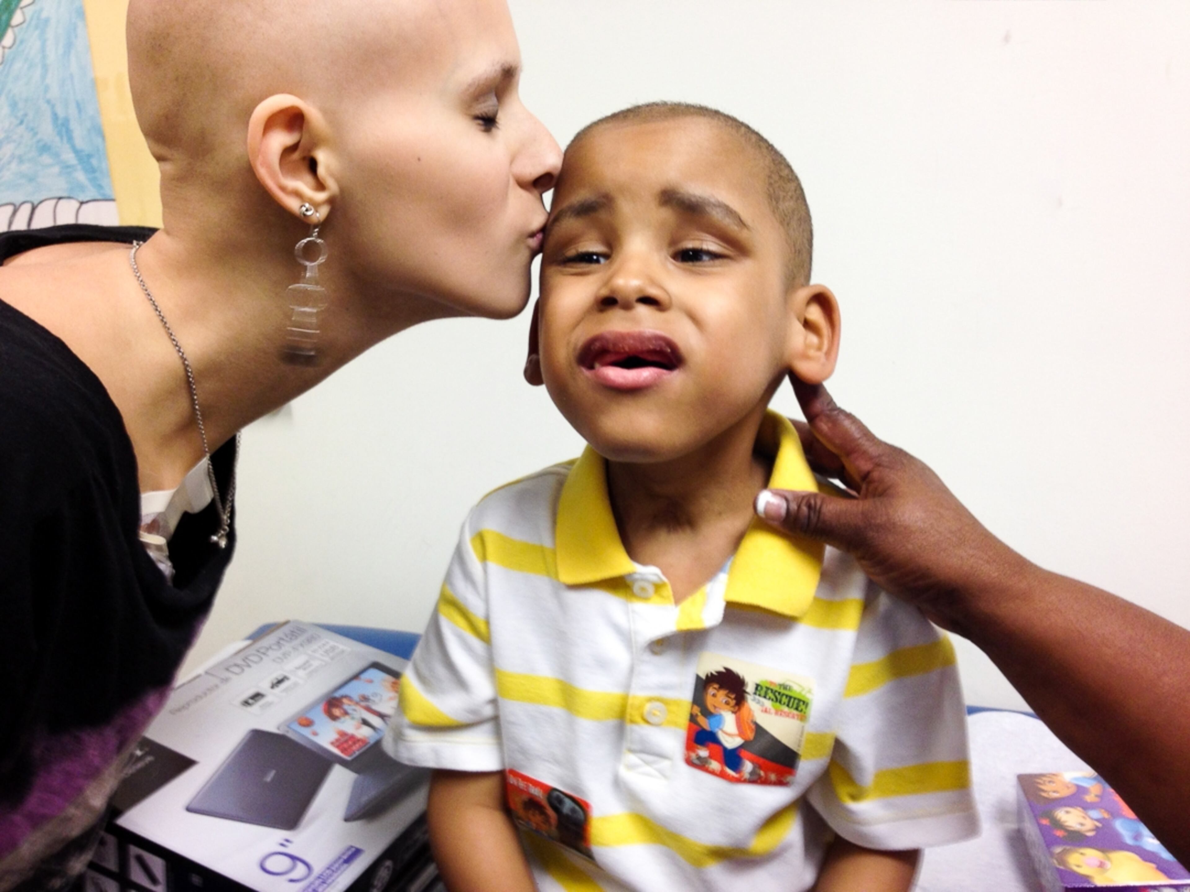 Summer gives Kourtney Smith, 5, $300 worth of gas cards so his grandmother can drive him to chemo instead of taking the medicare bus, which takes about seven hours. Kourtney also received a portable DVD player to take to the hospital with him and some of his favorite movies.