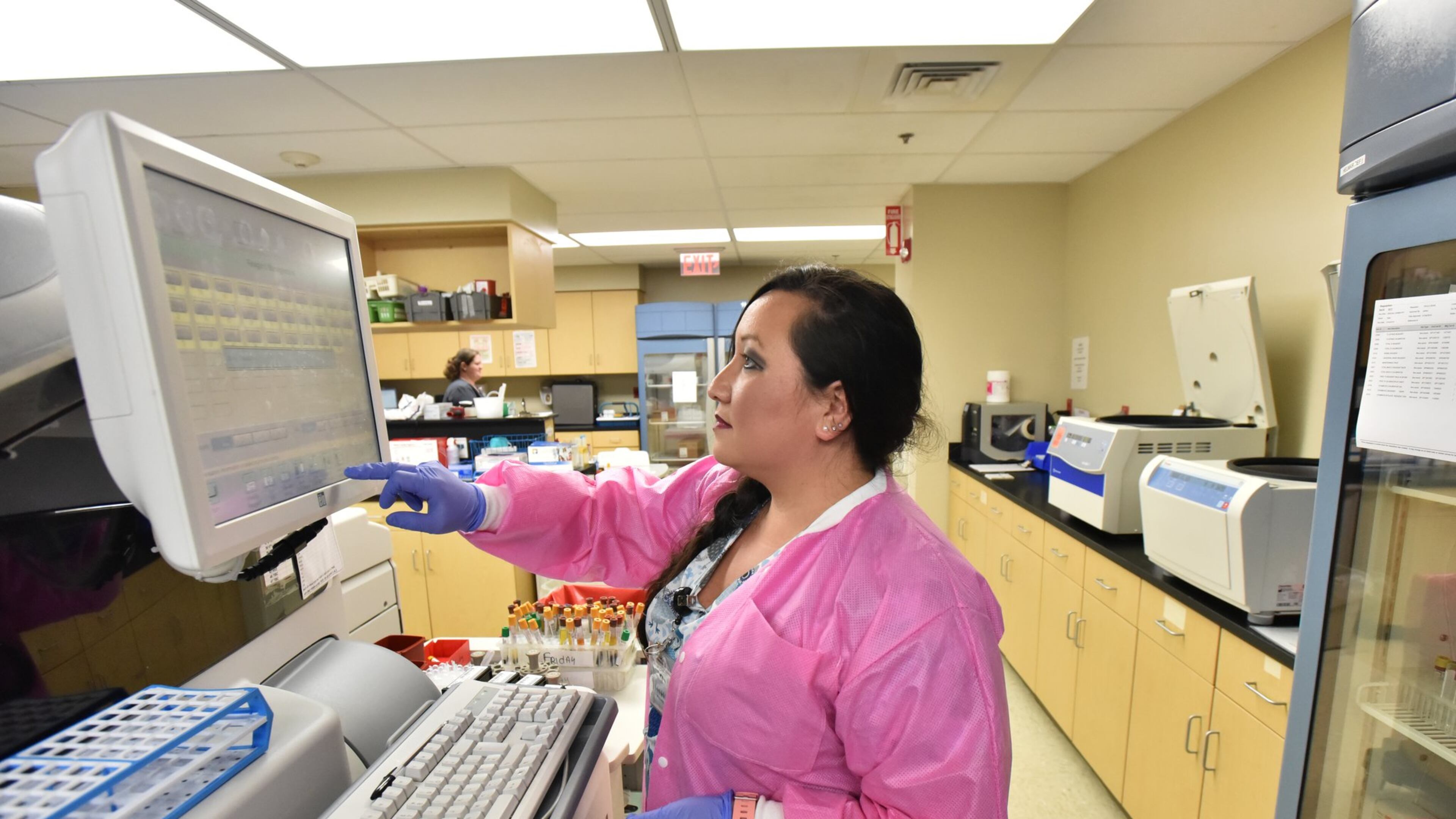 Tammy Potts operates a testing device in a laboratory at Wayne Memorial Hospital in Jesup. Wayne Memorial has to treat all comers, whether they can pay or not, and they’re concerned about private profit-making businesses cherry-picking the profitable procedures and leaving public hospitals to fail. Photo by HYOSUB SHIN / HSHIN@AJC.COM