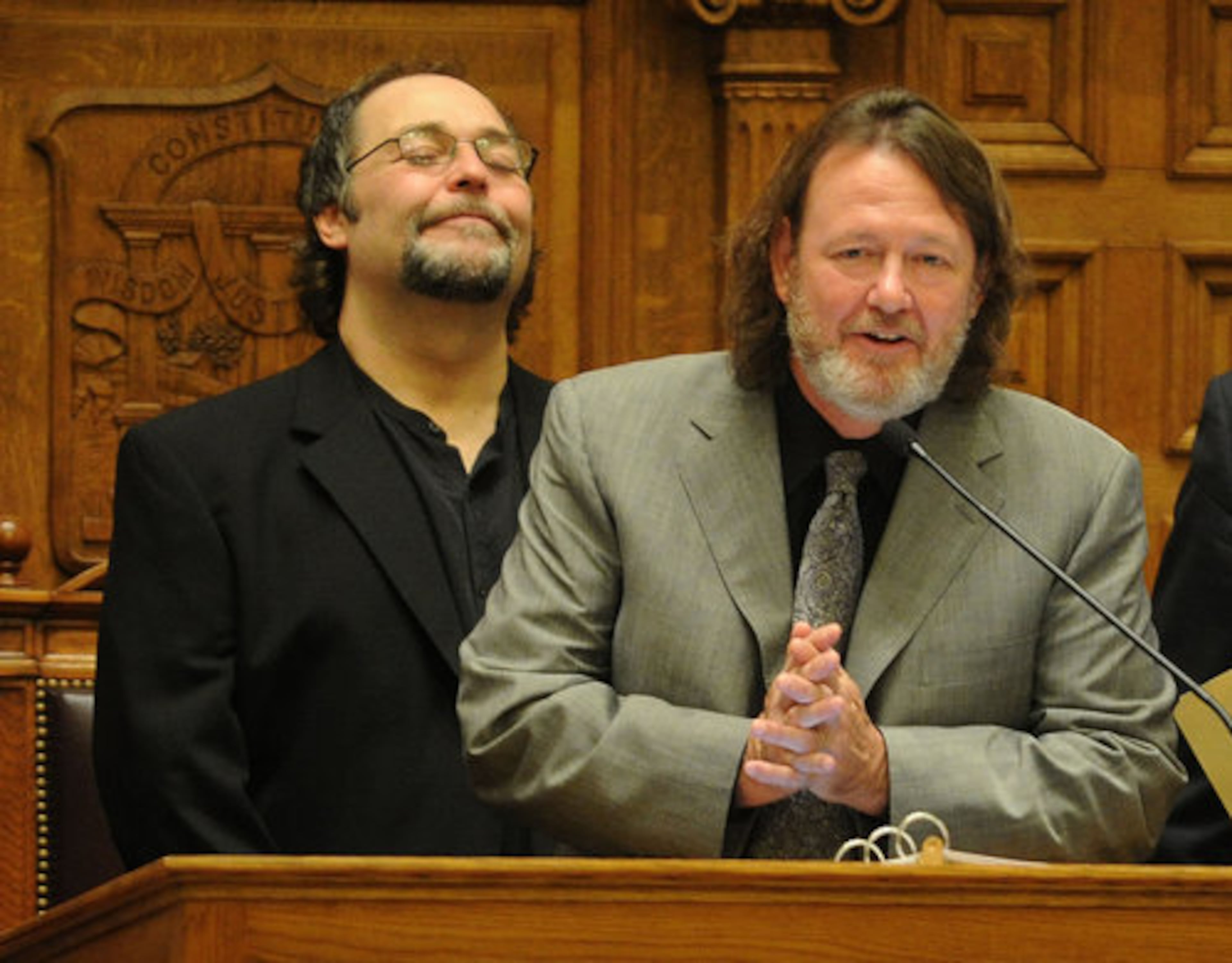 Widespread Panic lead singer John Bell speaks inside the Georgia Senate as band member Todd Nance smiles, on Tuesday, Feb 15, 2011.